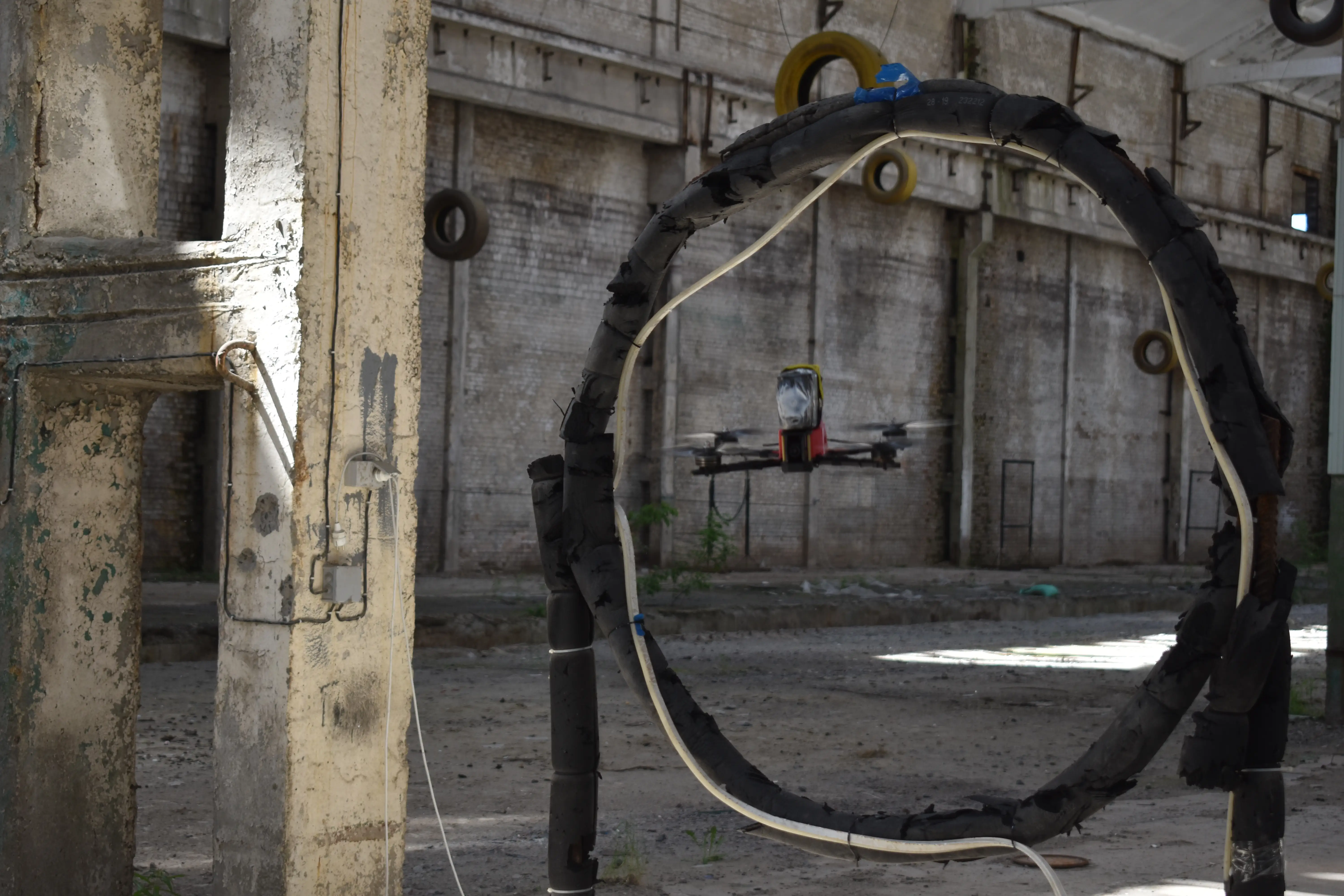 A drone navigates through an obstacle.