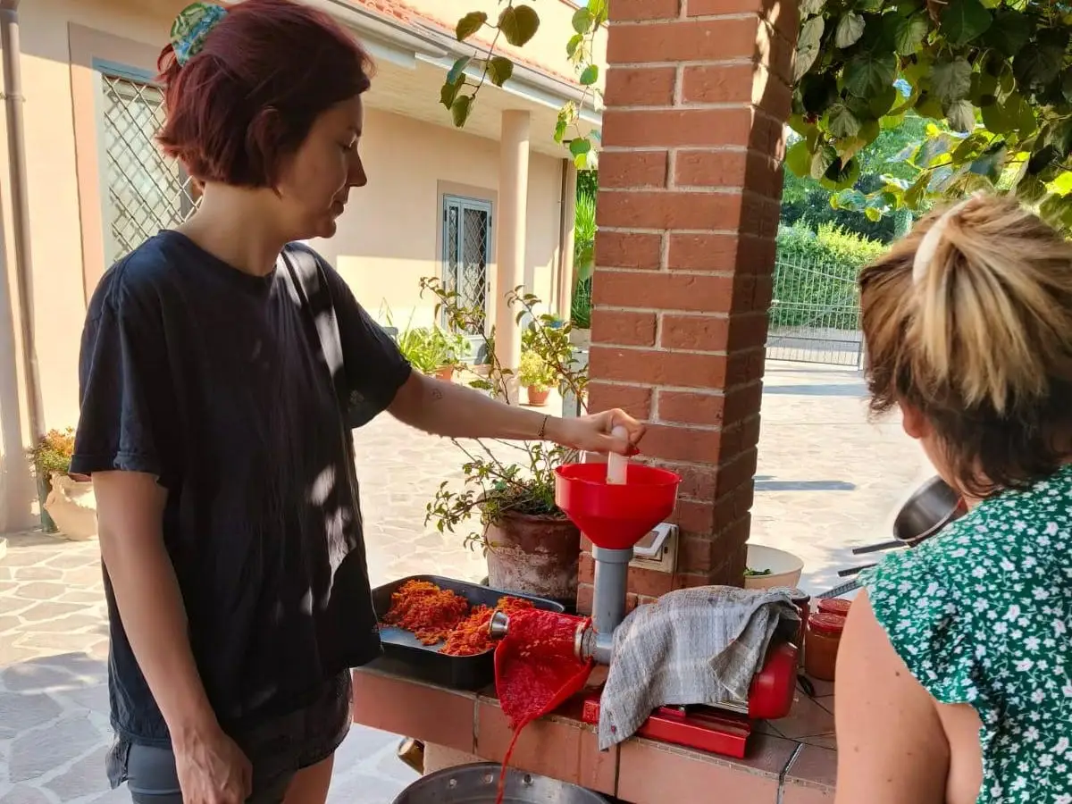The author's partner's mom prepares food for a family meal.