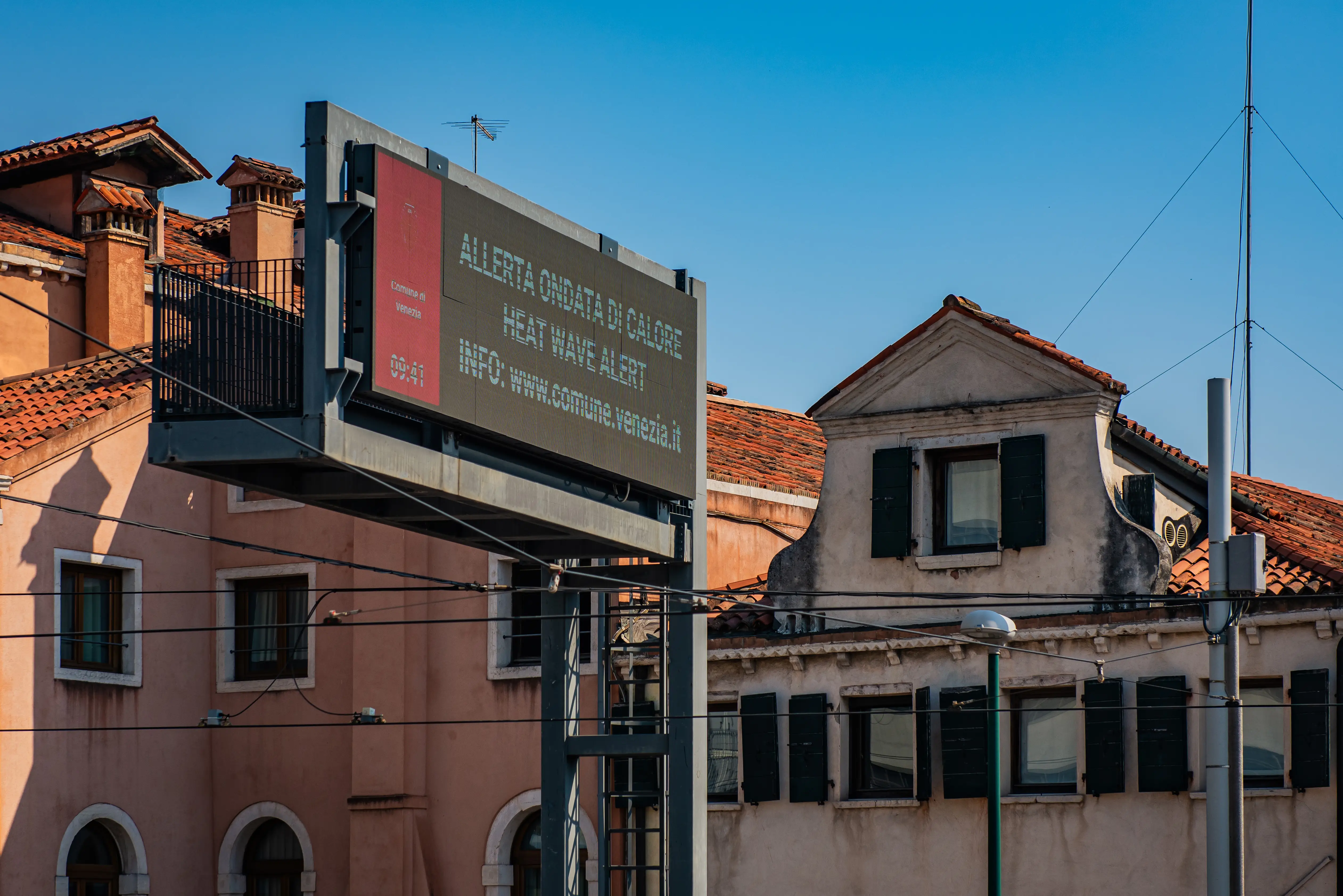A billboard warns of a heat wave alert in Venice, Italy.
