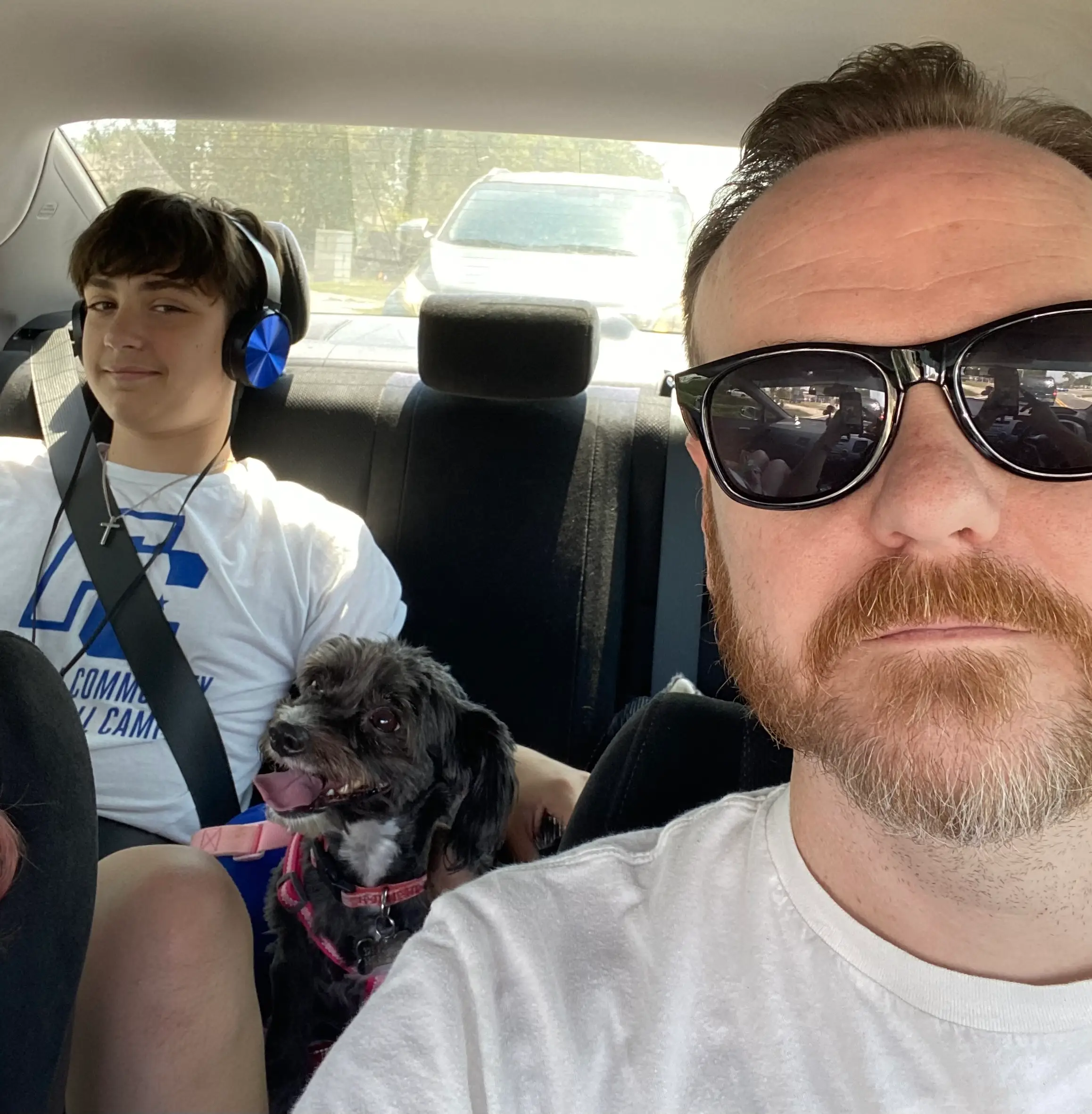 The author's husband and son in the car.