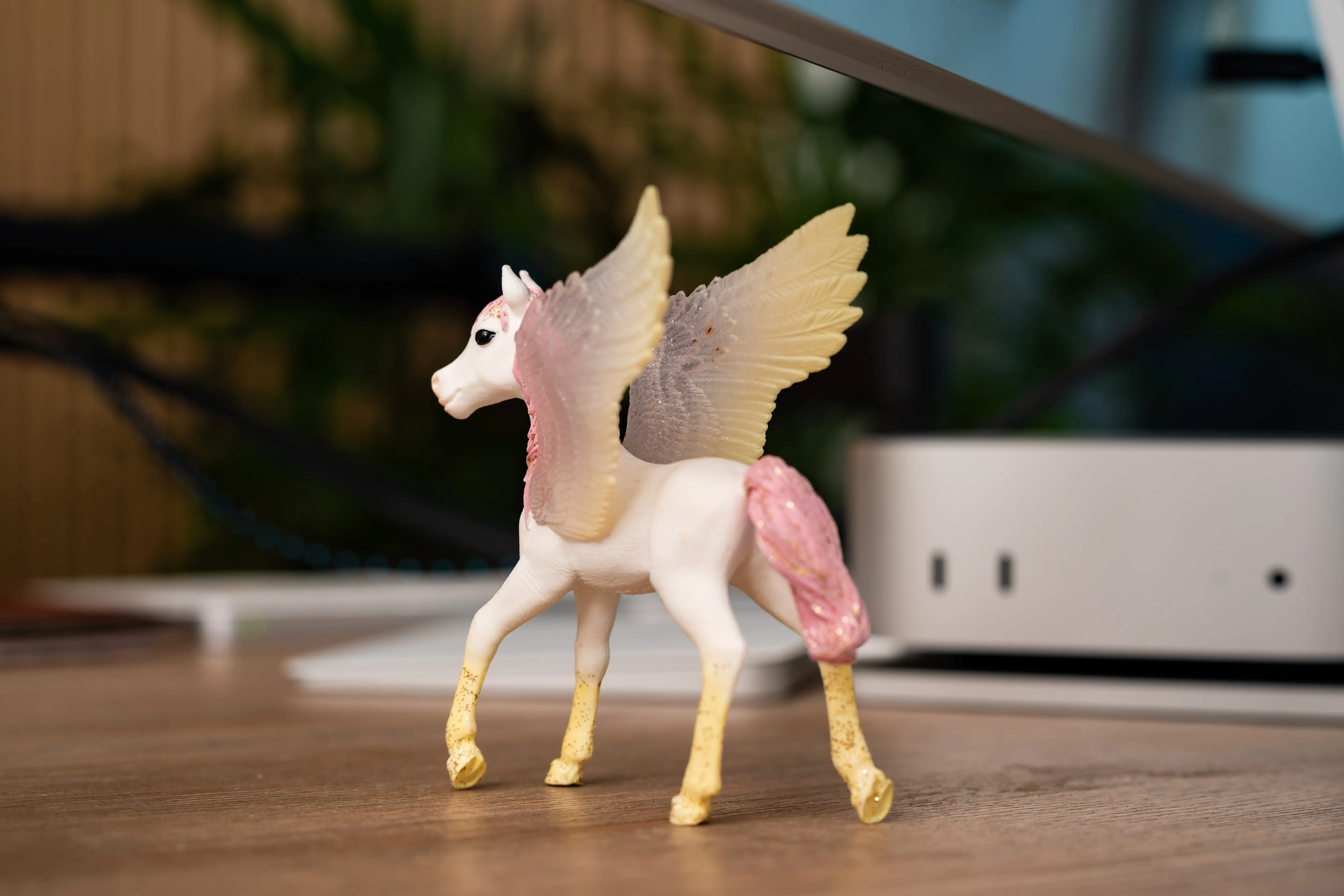 A unicorn figurine sits on top of Kristina's desk.