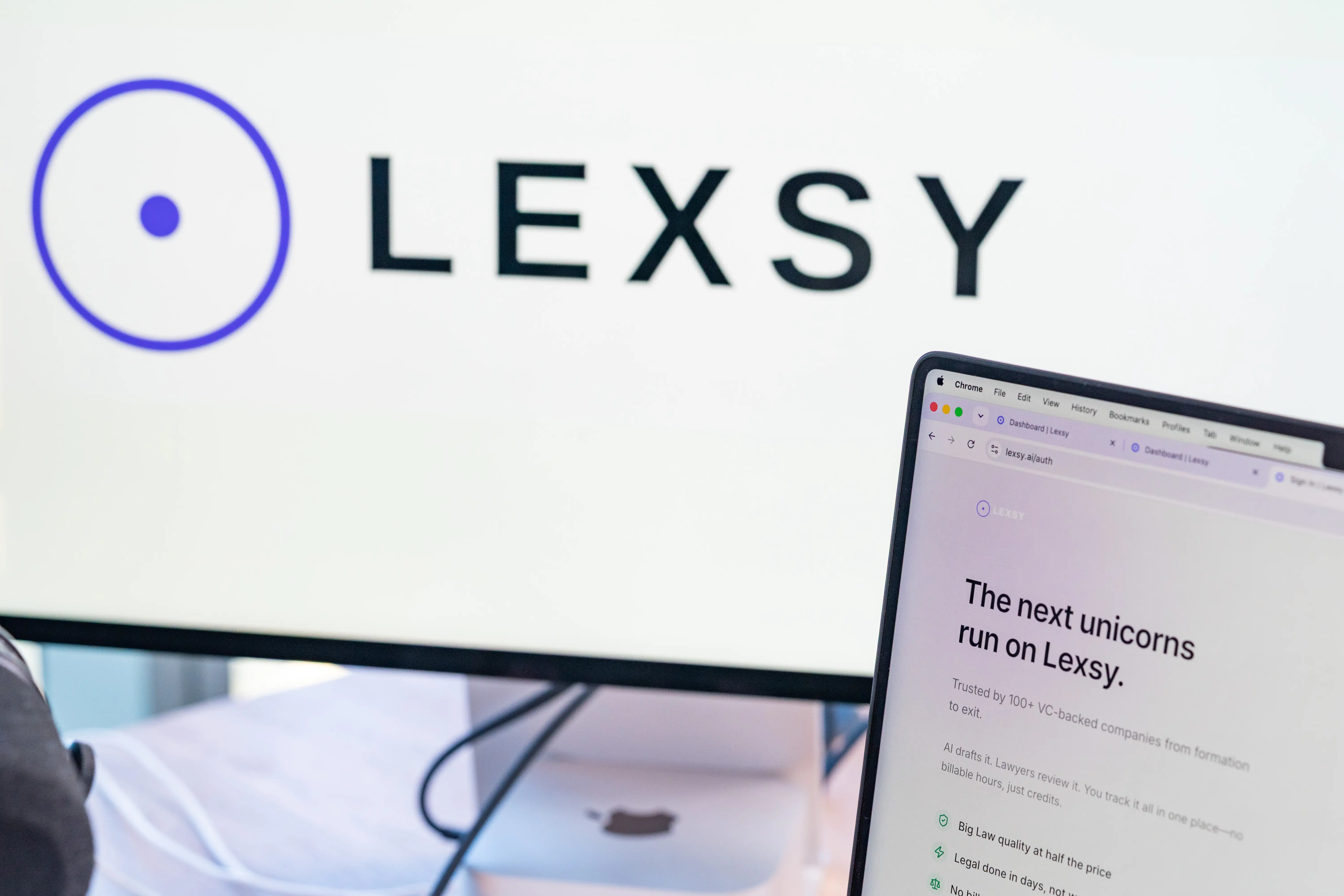 Lexsy's interface shown on two computer screens.