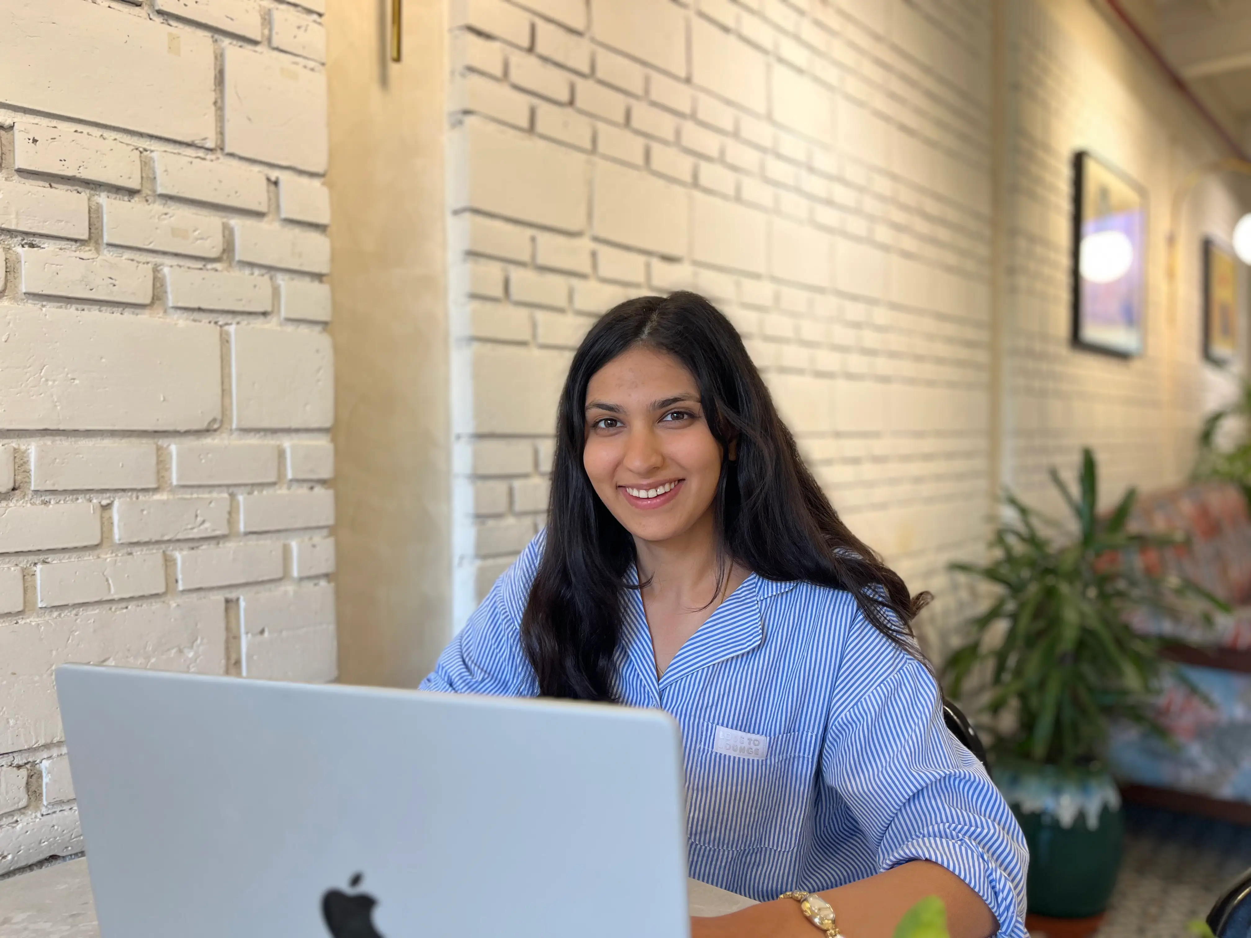 Nitya Kumar is sitting at her laptop