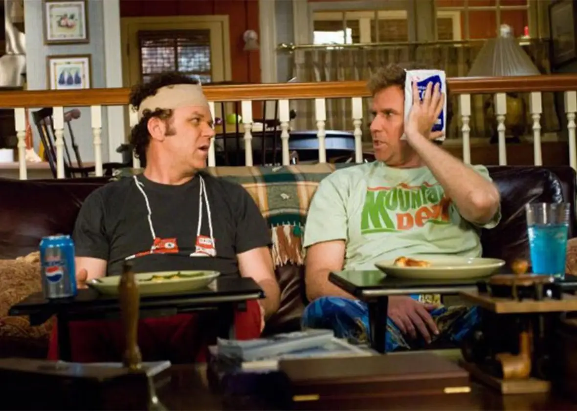 John C Reilly and Will Ferrell sitting on a couch in Ste Brothers movie