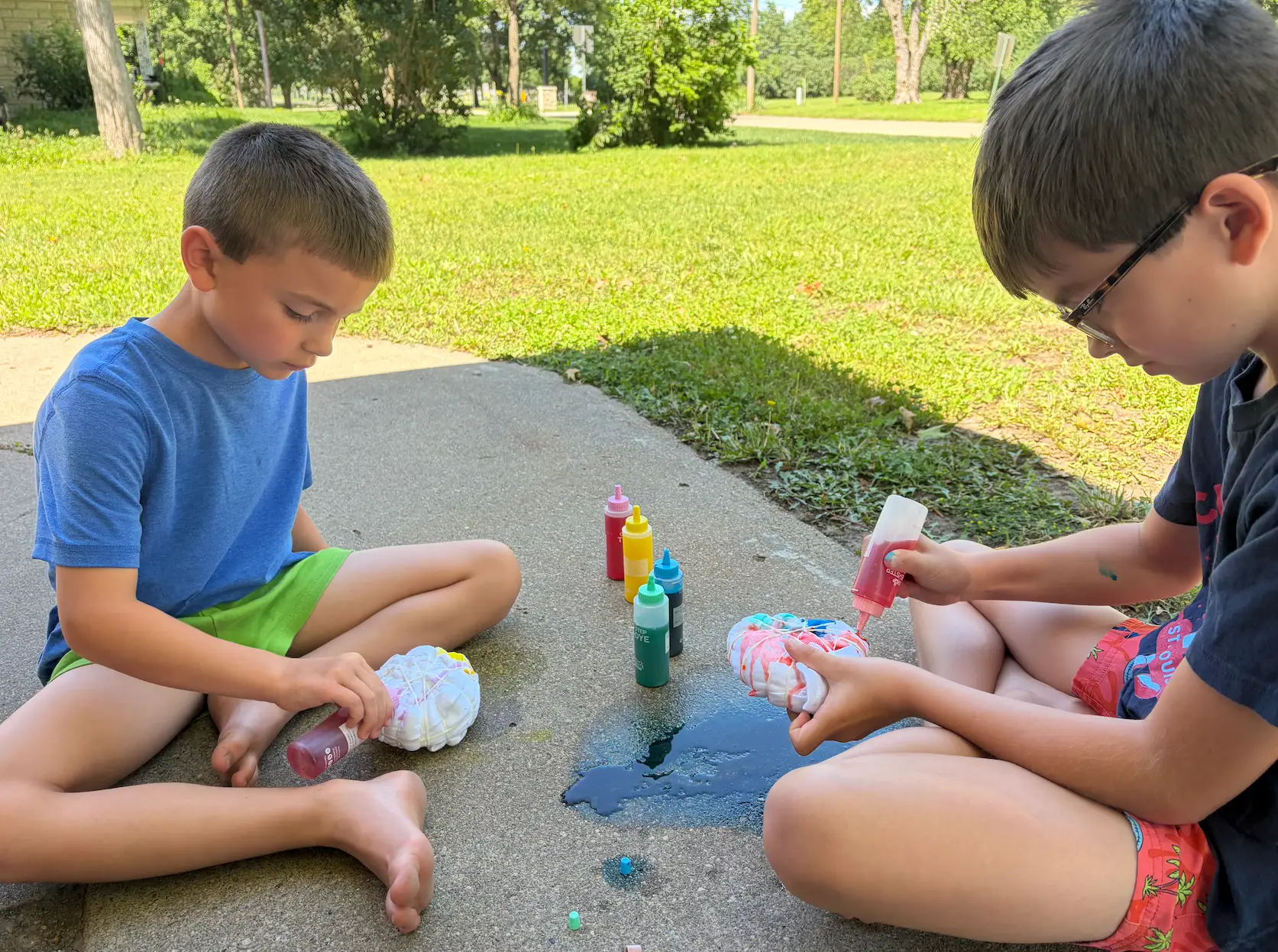 The author's kids tie-dyeing shirts.