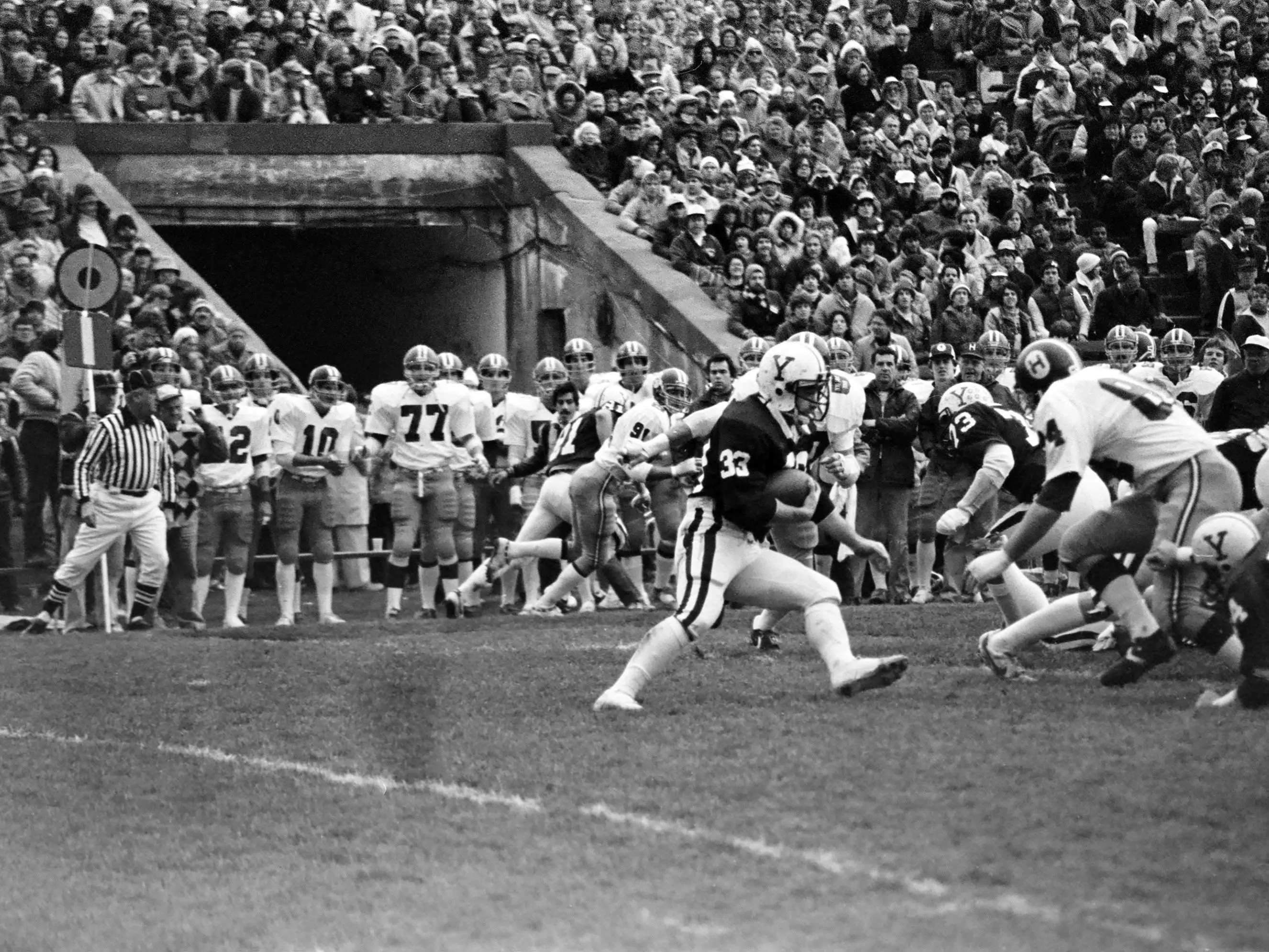 Players on the field at the Harvard-Yale football game from 1981
