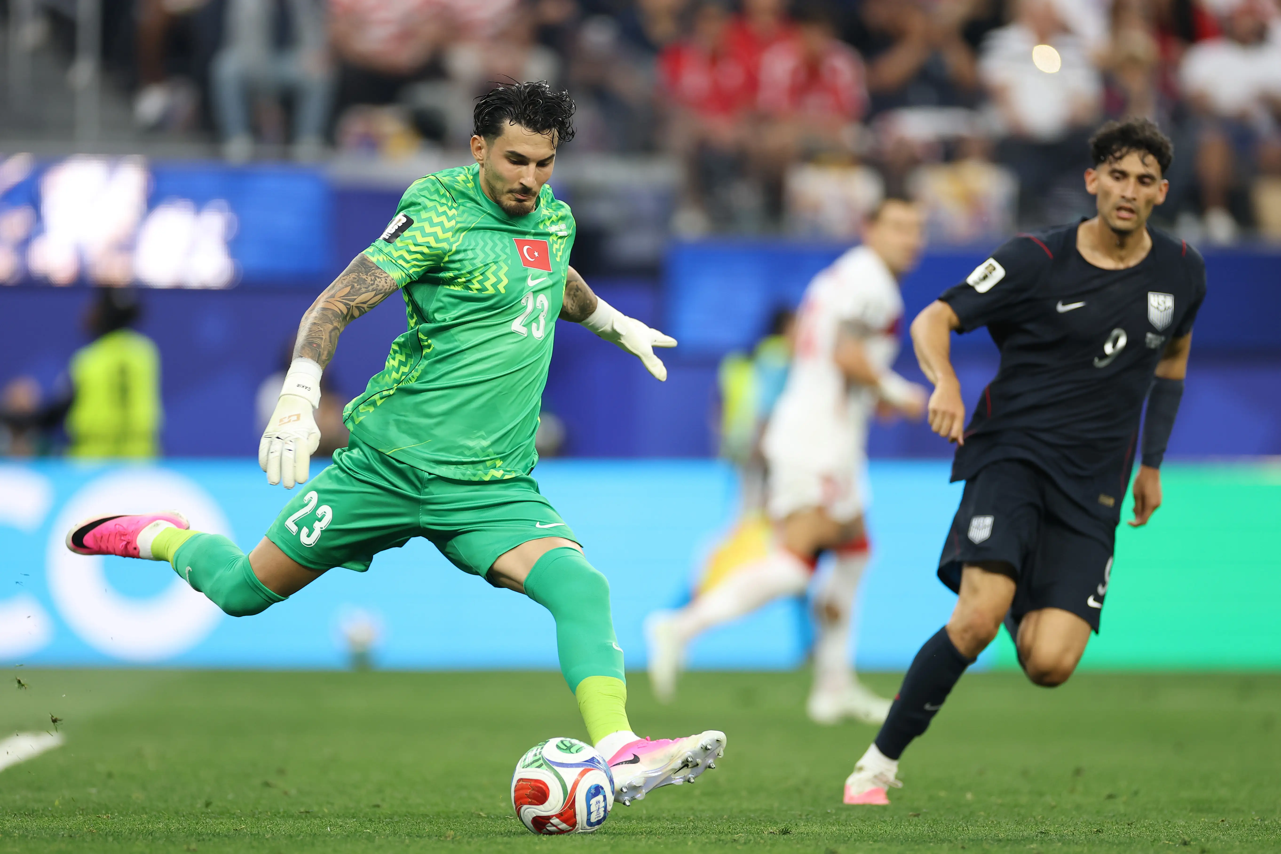 Two soccer players playing on the field.