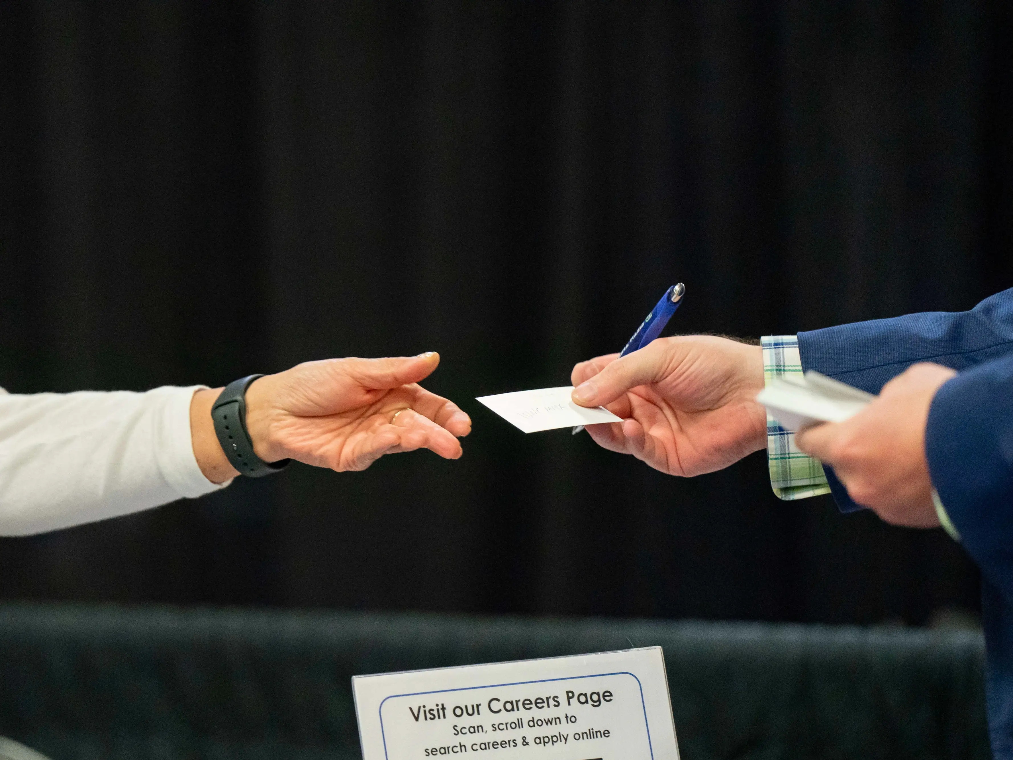 Person handing over card