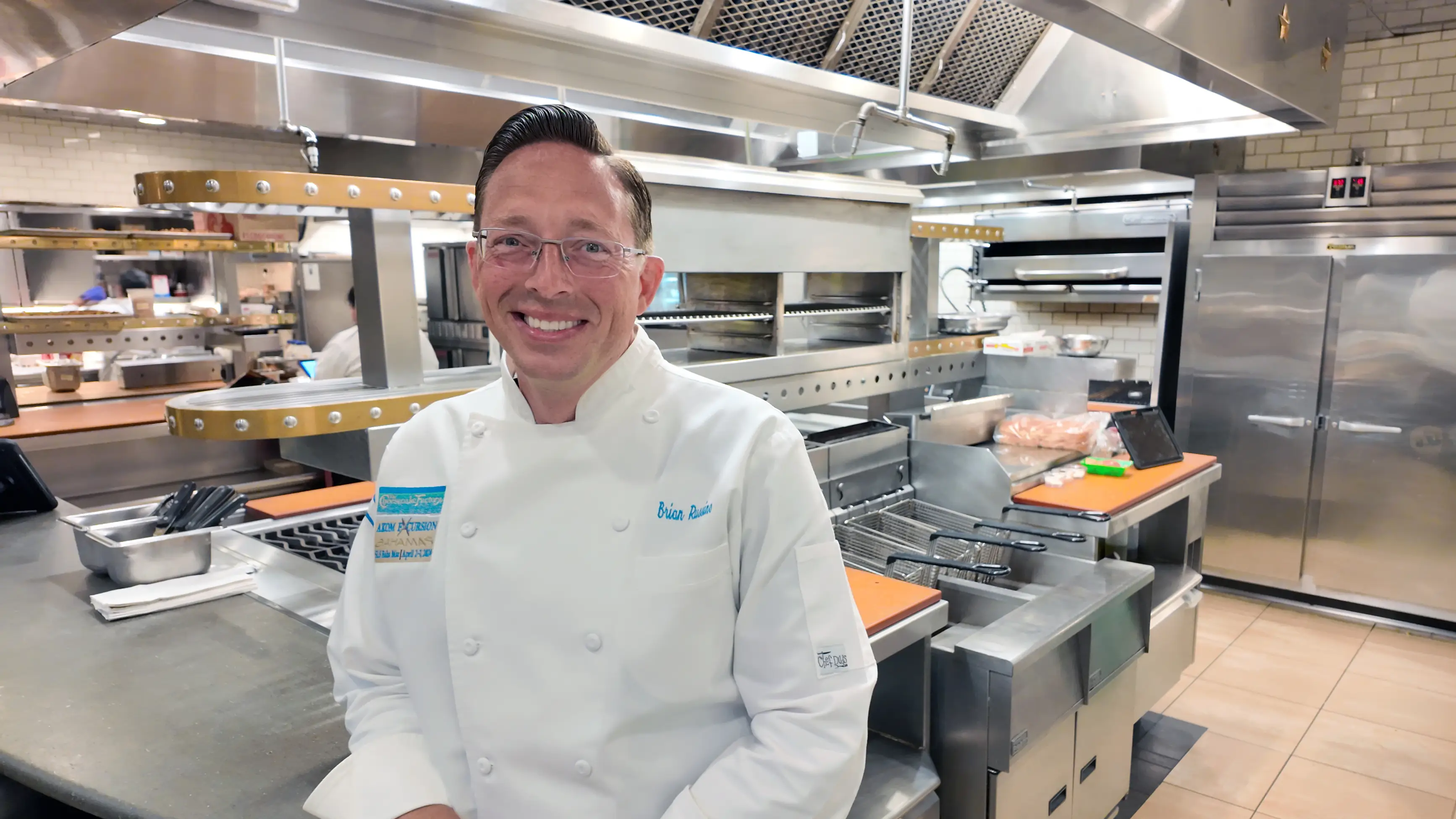 Photo of Brian Russino in a kitchen setting.