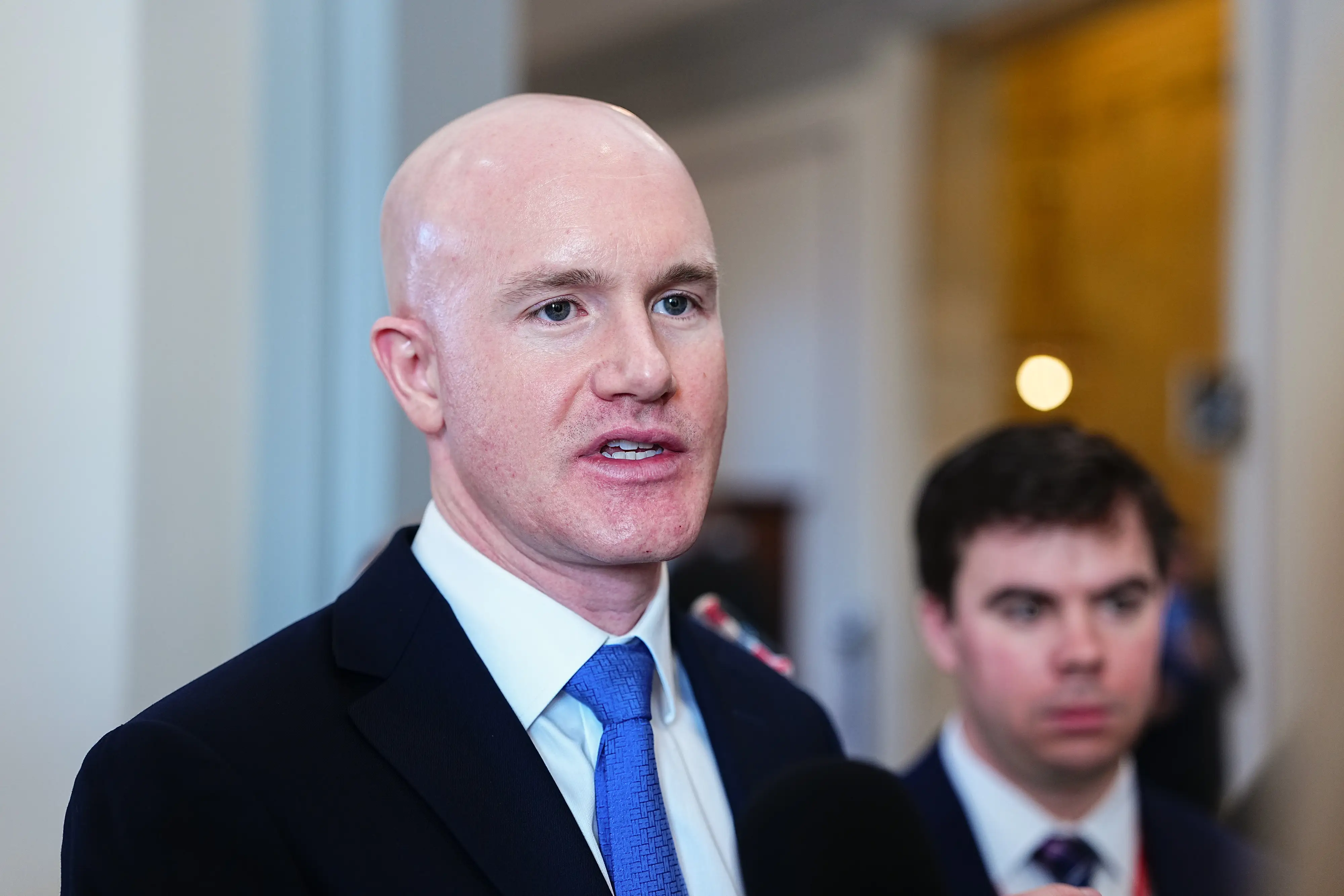 Brian Armstrong, chief executive officer of Coinbase Global Inc., speaks to members of the media on Capitol Hill in Washington, DC, US, on Thursday, Jan. 15, 2026.