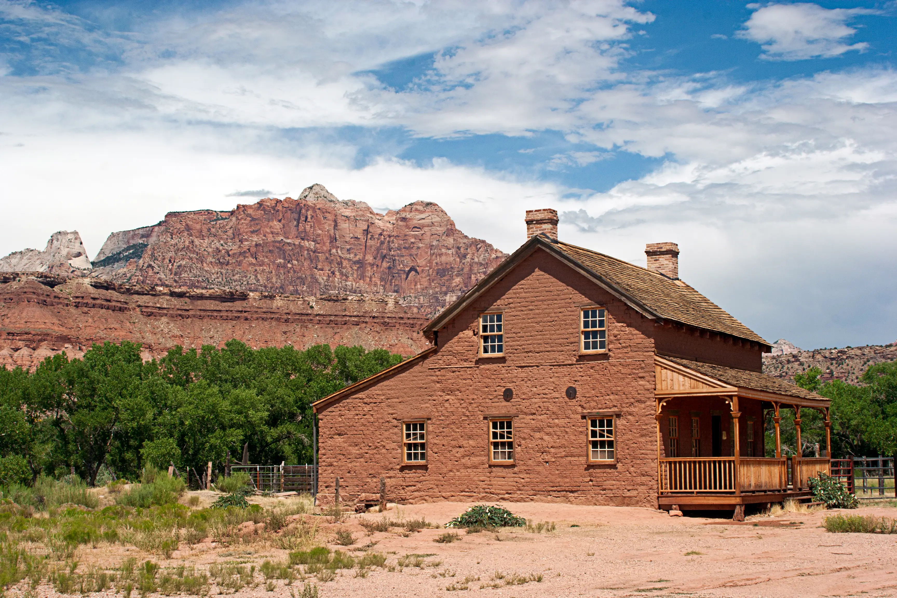 homestead from the 1850's in the Ghost Town of Grafton, Utah with buttes in background