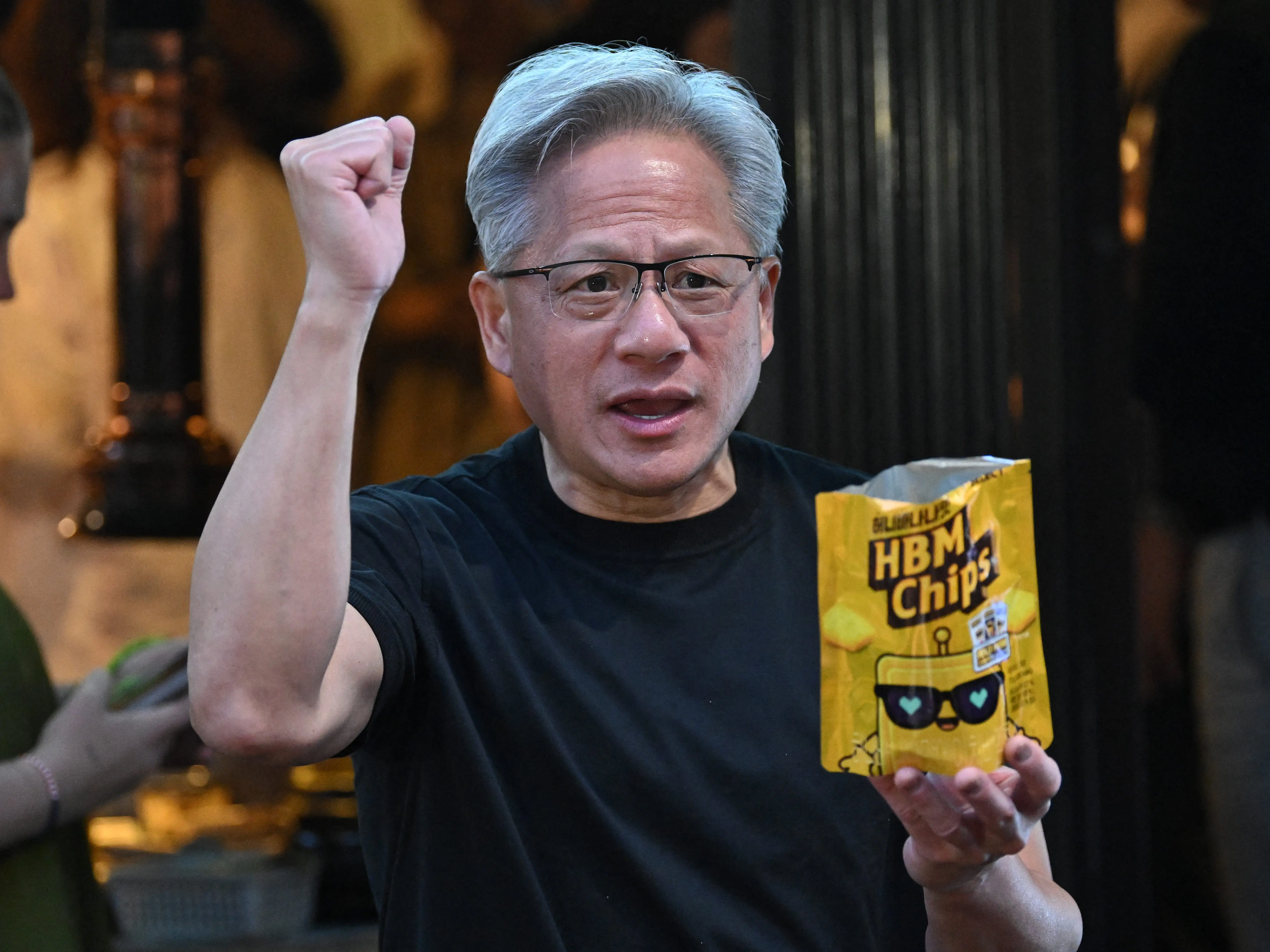 Nvidia CEO Jensen Huang hands out HBM chip snacks to reporters in Seoul on June 5.