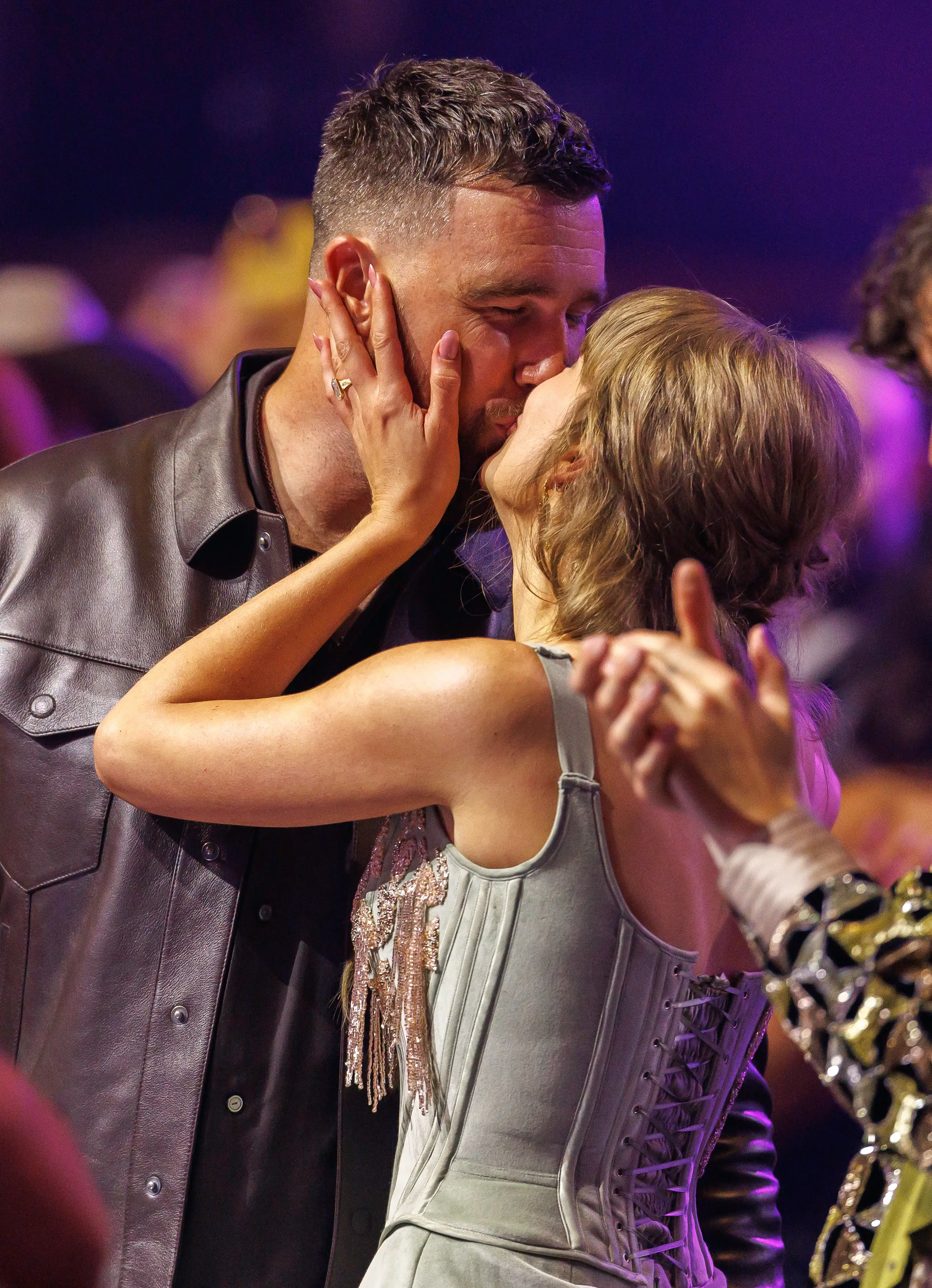 Travis Kelce and Taylor Swift kiss at the 2026 iHeartRadio Music Awards.