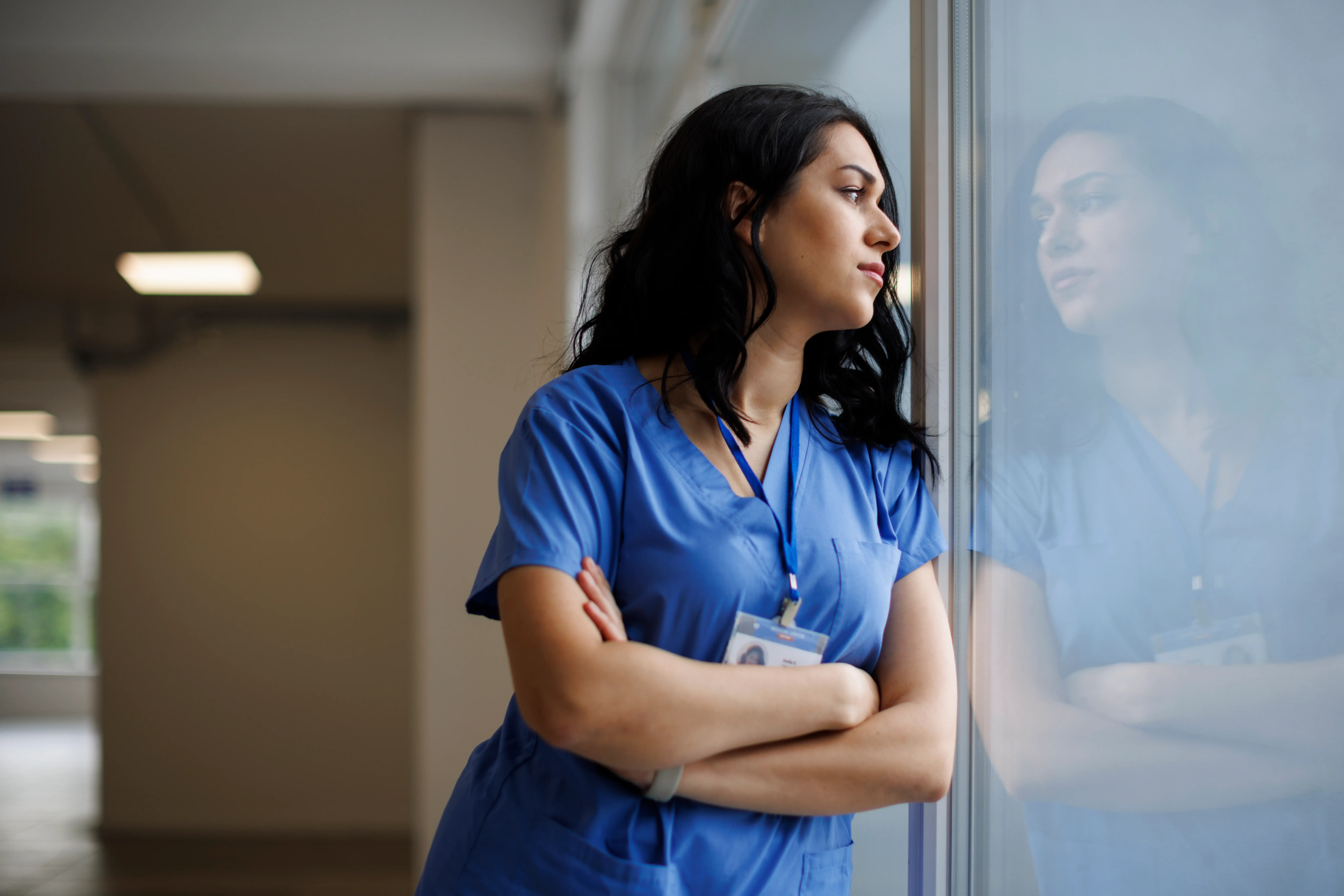 A nurse looking outside