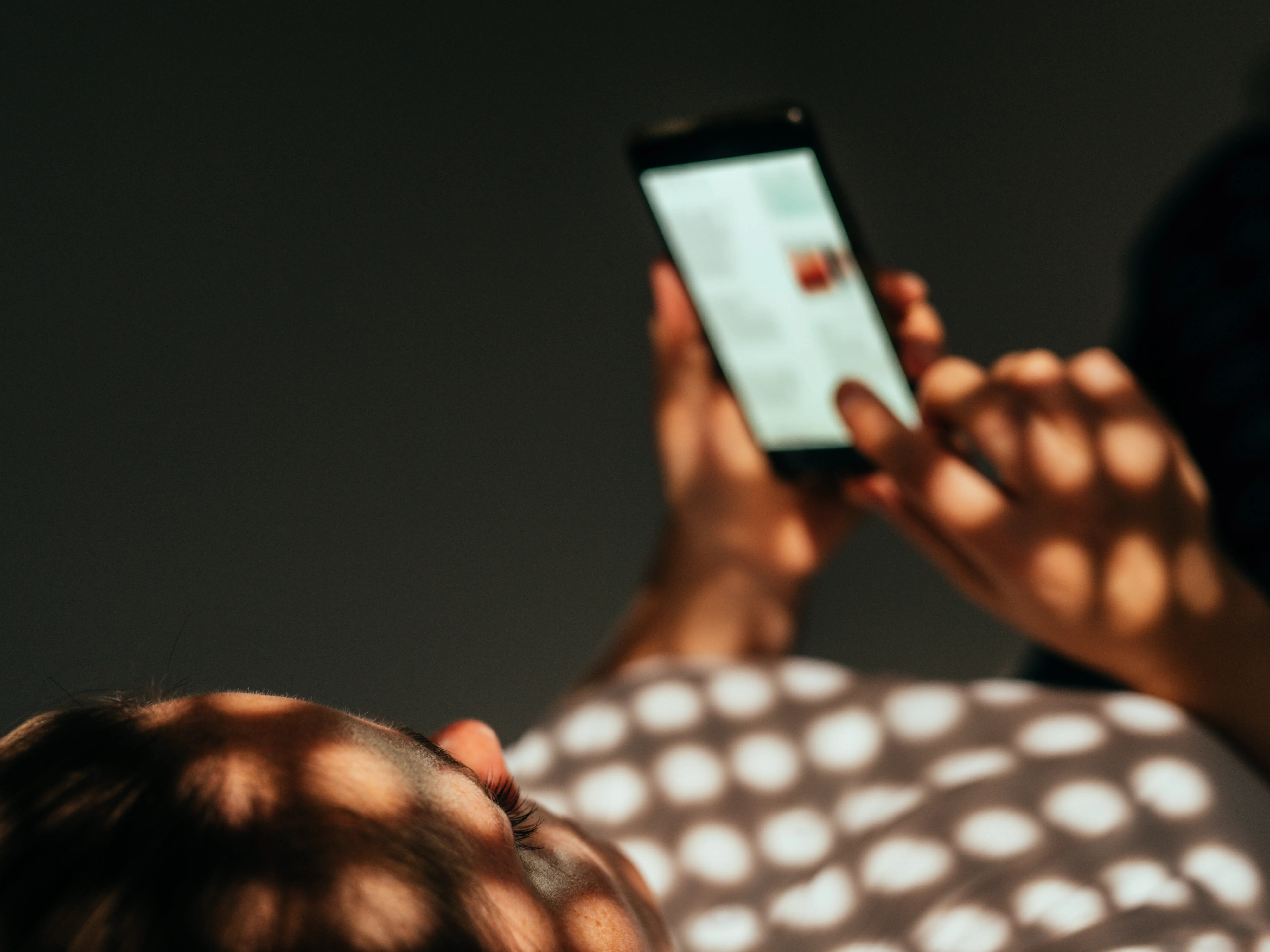 Woman scrolling on phone