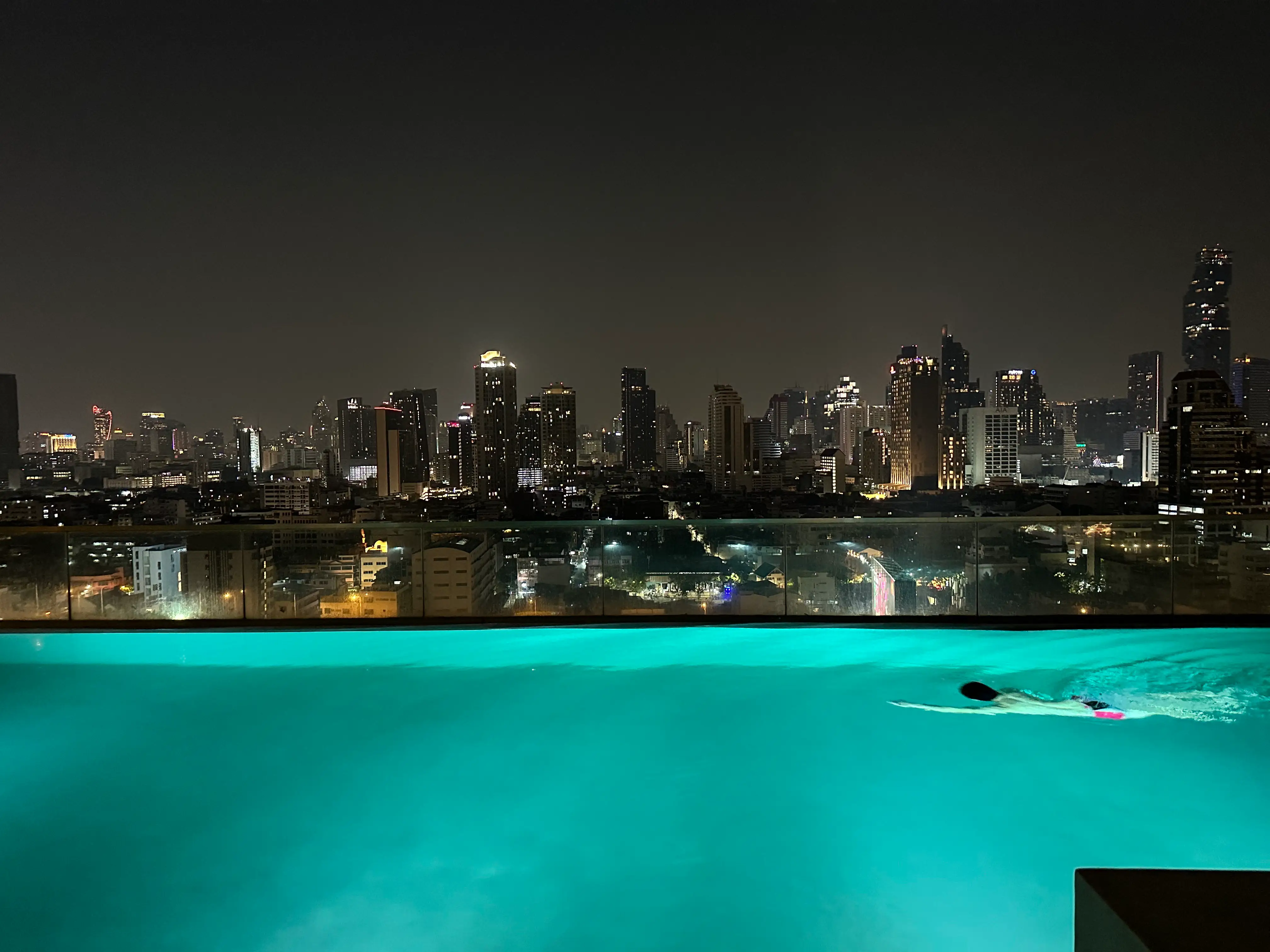 An infinity pool on the rooftop of a Bangkok apartment.