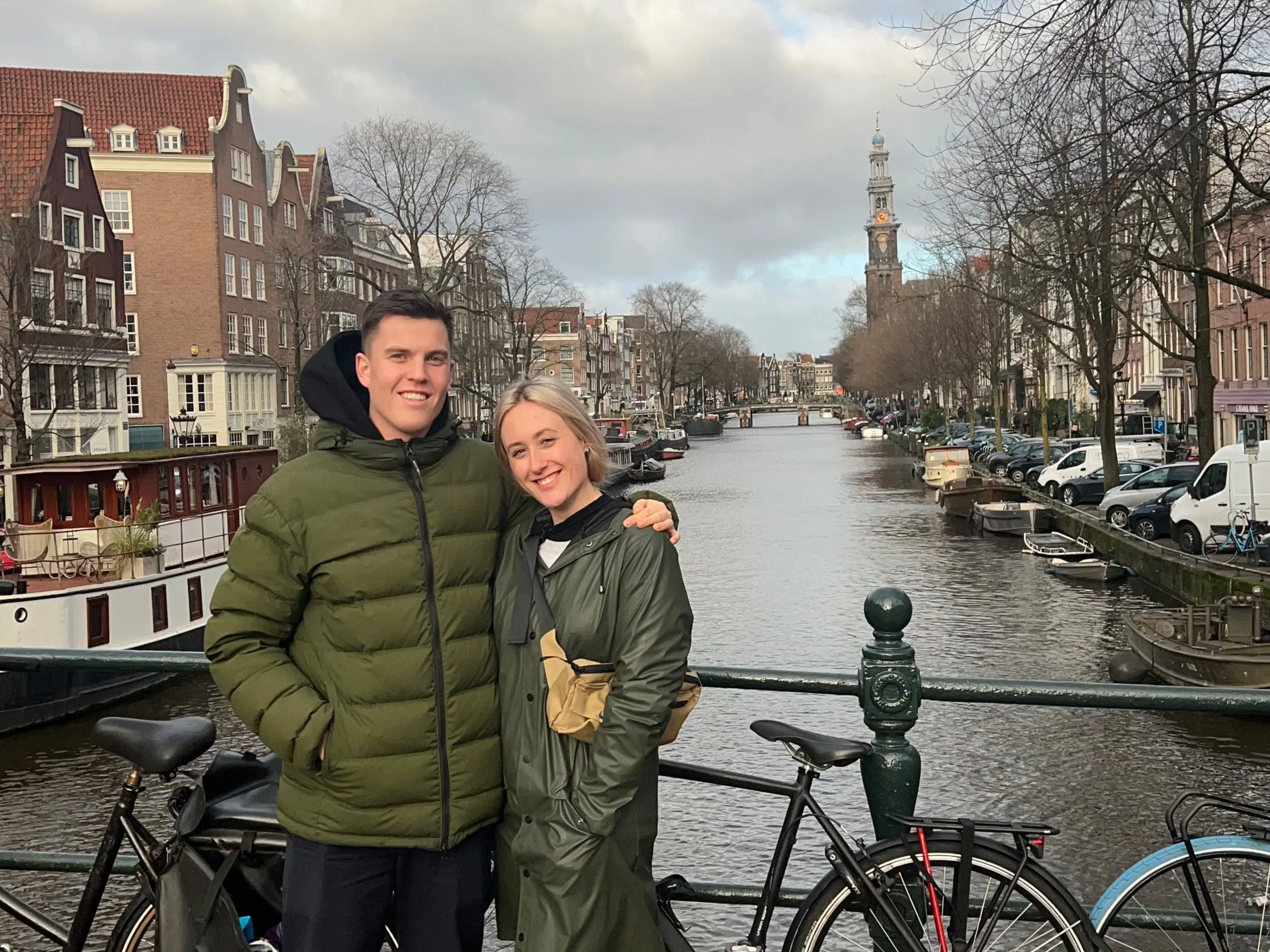 Amanda and her boyfriend pose for a photo near a canal in Amsterdam.