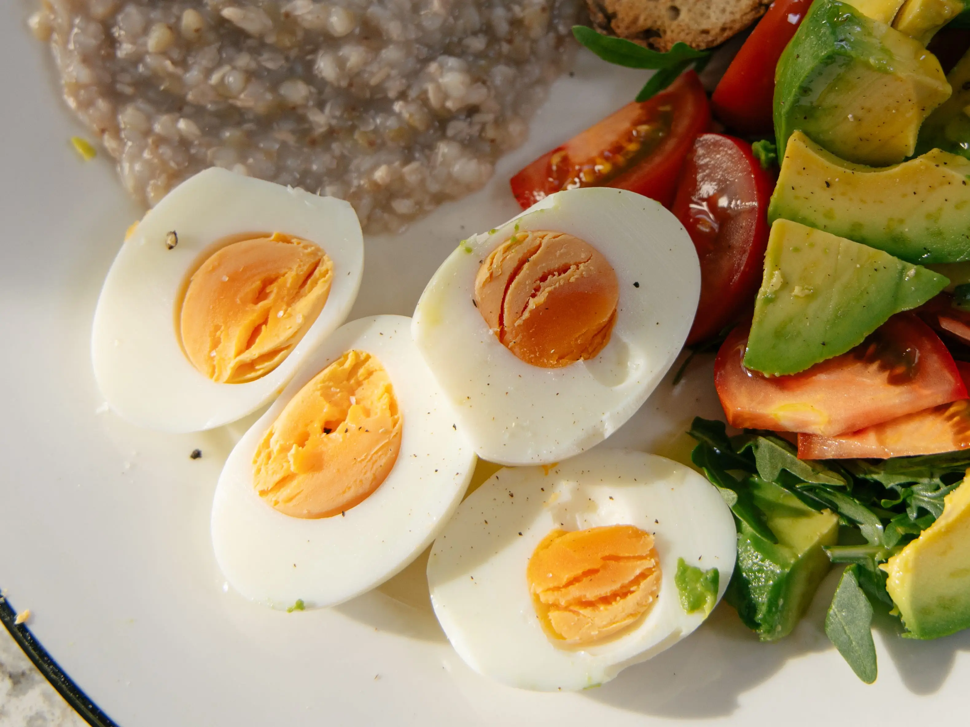 Plate with eggs, salad, grains