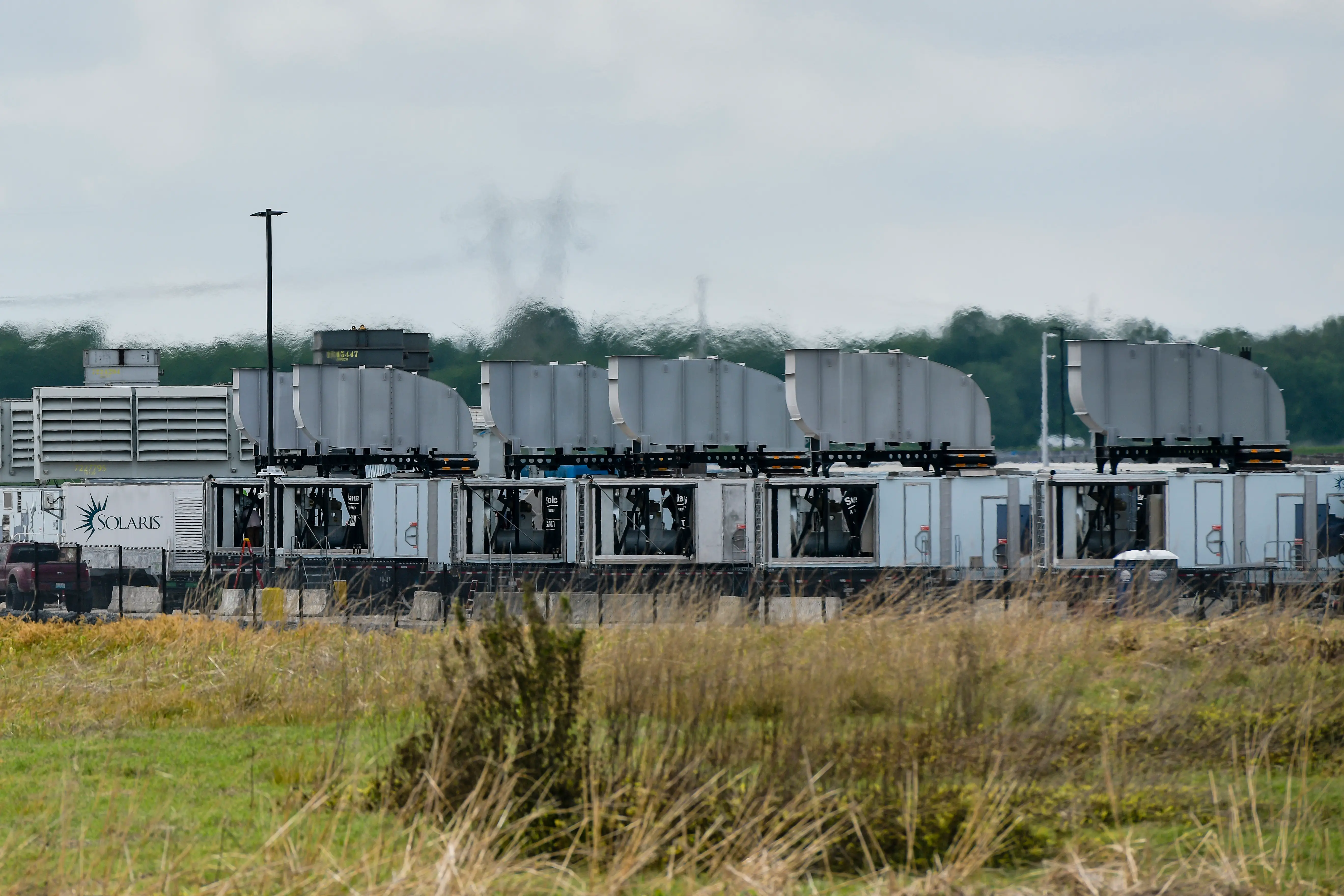 Gas turbines are visible at an xAI data center on Riverport Rd in Memphis, TN on April 25, 2025. (Photo by Brandon Dill for The Washington Post via Getty Images)
