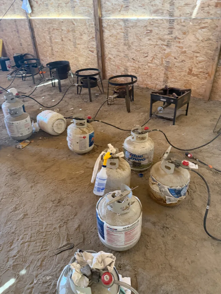 Propane tanks and burners used in a narcotics production operation.