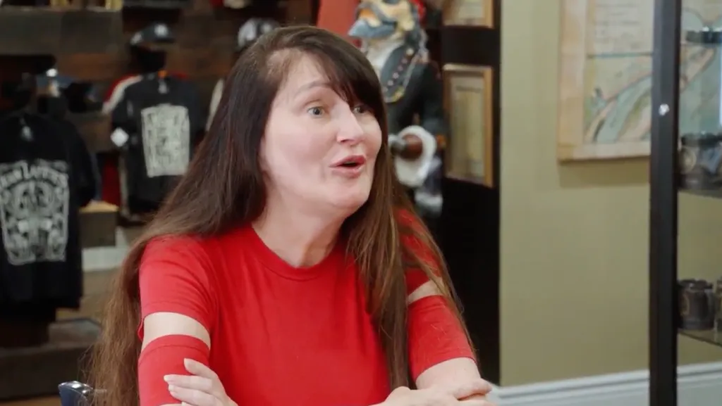 Debby from 90 Day Fiance with her mouth open, mid-conversation.