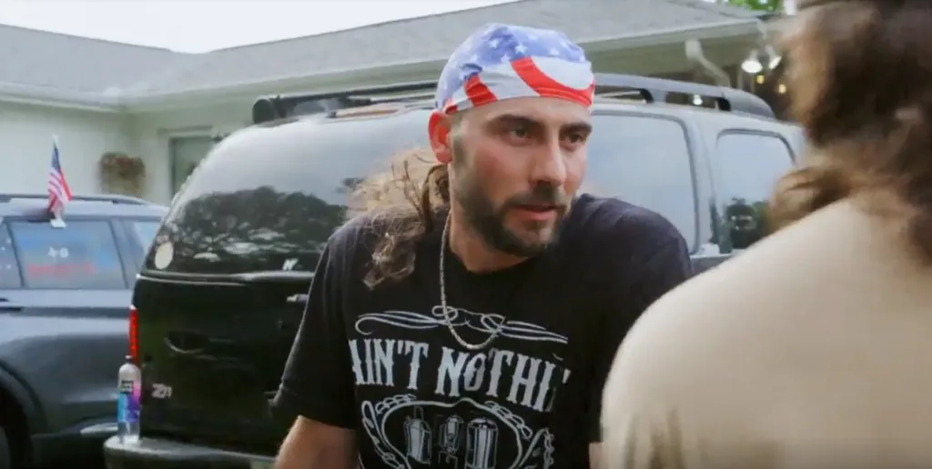 Rasit confronting Mallorie’s ex at his 'white trash bash'.