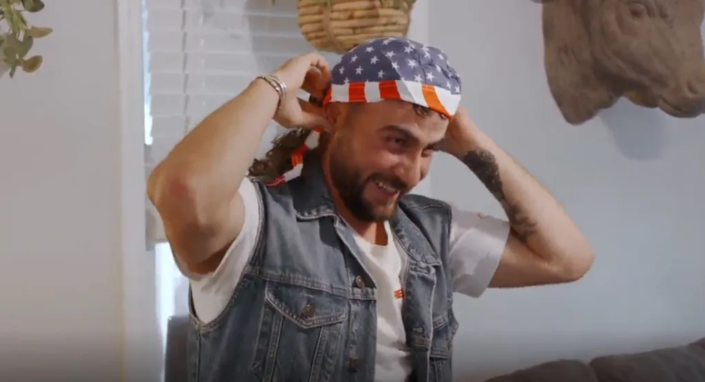 Rasit wearing a bandana with an American flag pattern.