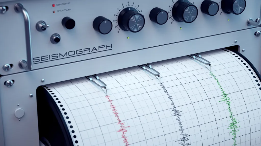 Illustration of a seismograph recording seismic activity with red, black, and green lines on a grid paper.
