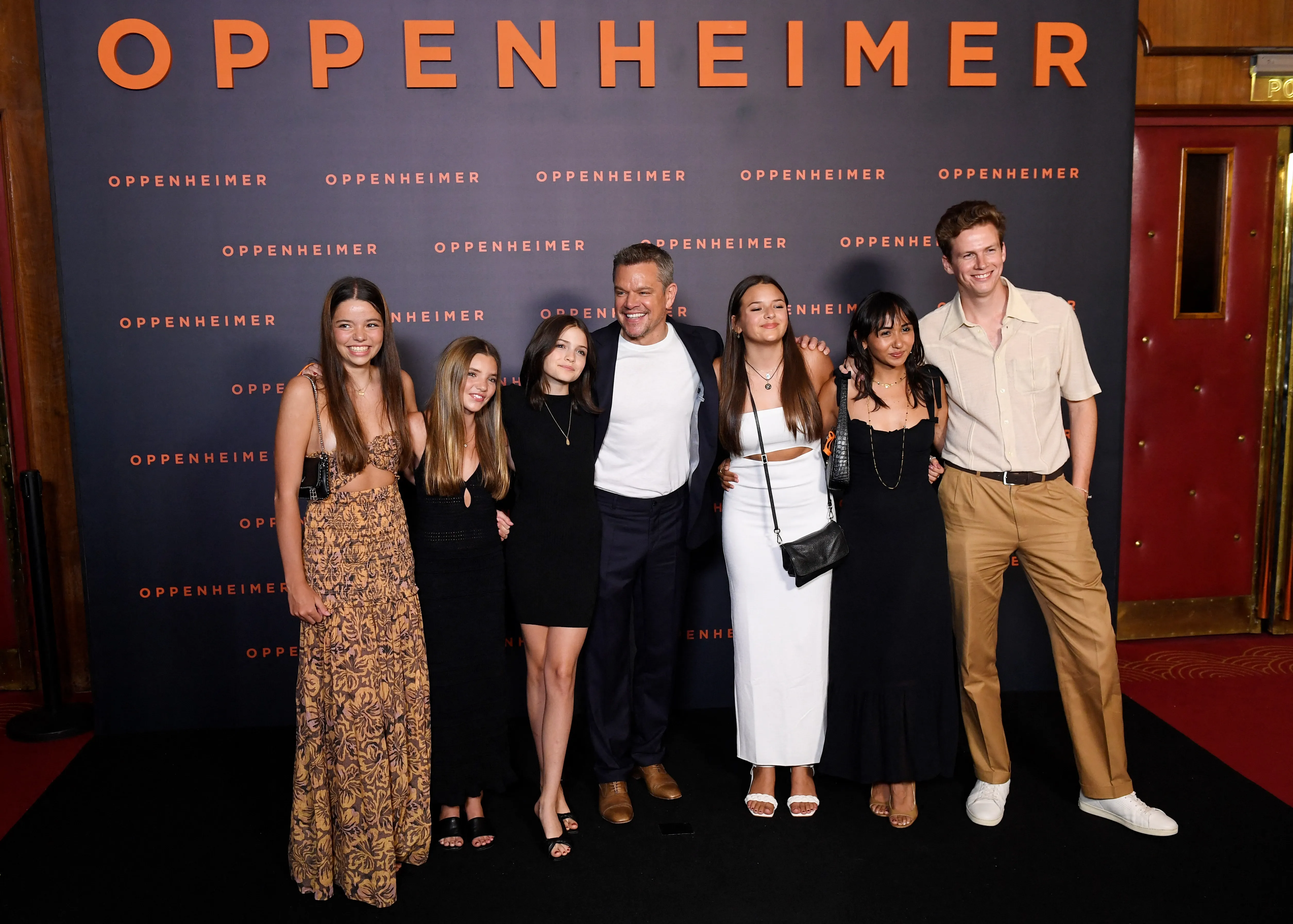 Matt Damon (C) poses with his daughters Stella Damon, Gia Damon and Alexia Barroso upon their arrival for the 
