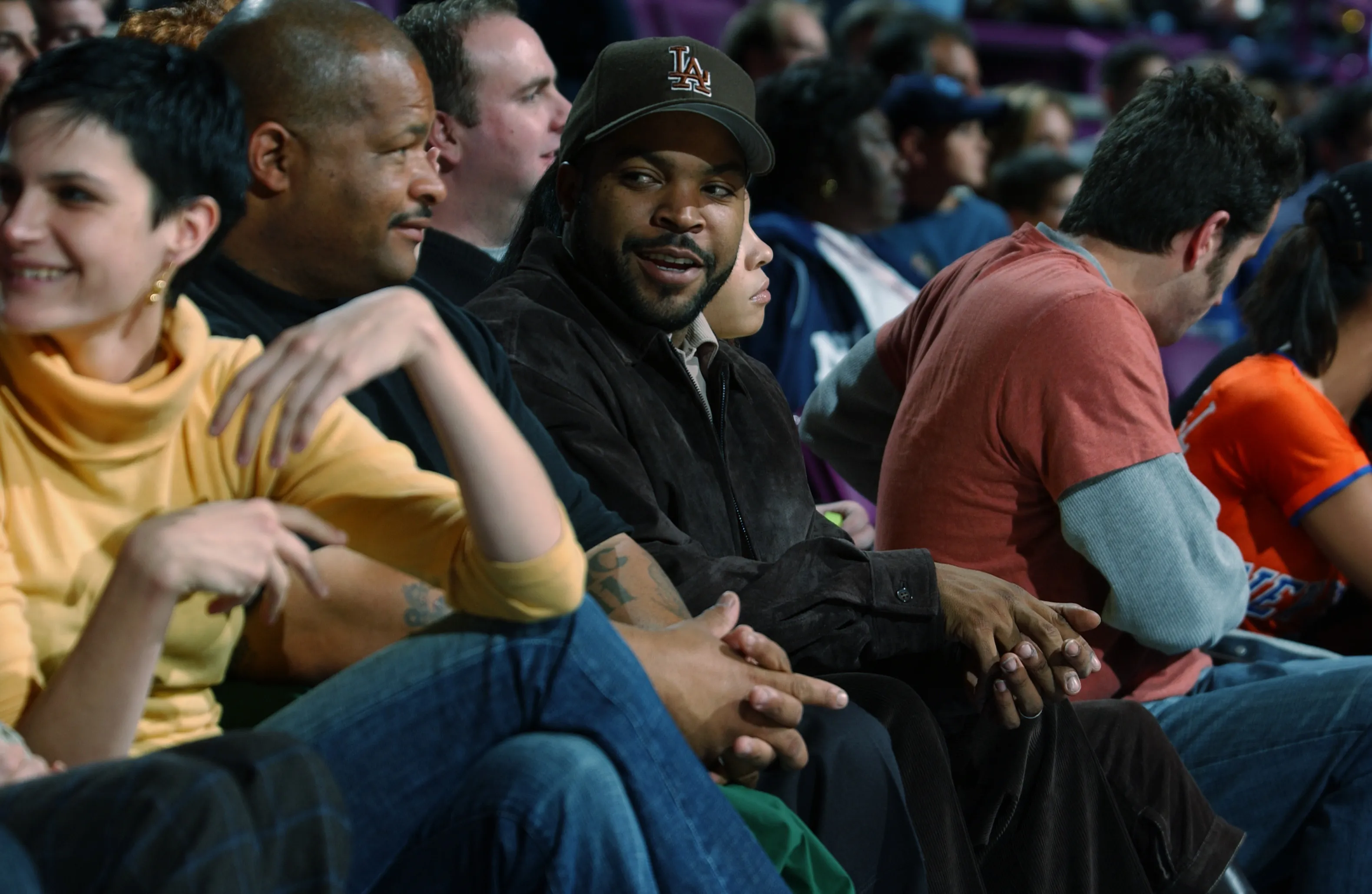 Ice Cube sits courtside during the game between the Detroit Pistons and the New York Knicks at Madison Square Garden on November 18, 2002 in New York.