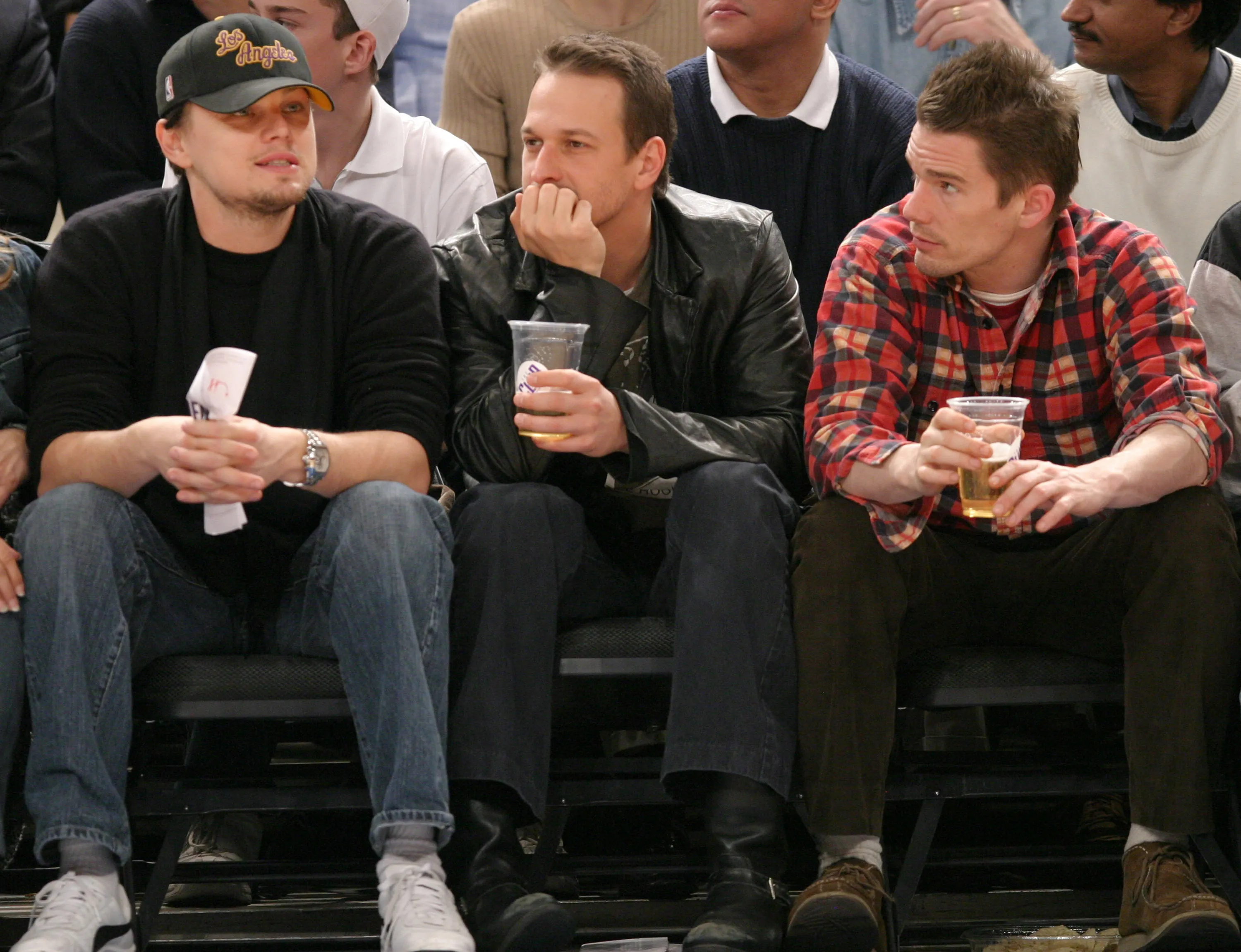 Leonardo DiCaprio, Josh Charles and Ethan Hawke during Celebrities Attend New Jersey Nets vs. New York Knicks Game at Madison Square Garden in New York City