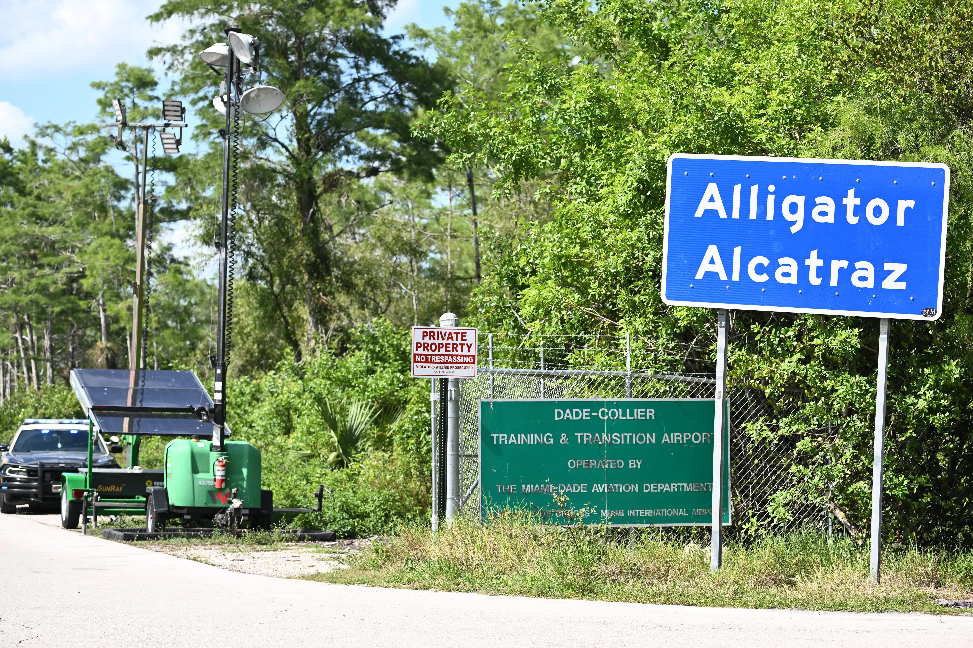 A Florida Highway Patrol car is seen at the entrance to the immigrant detention center known as 