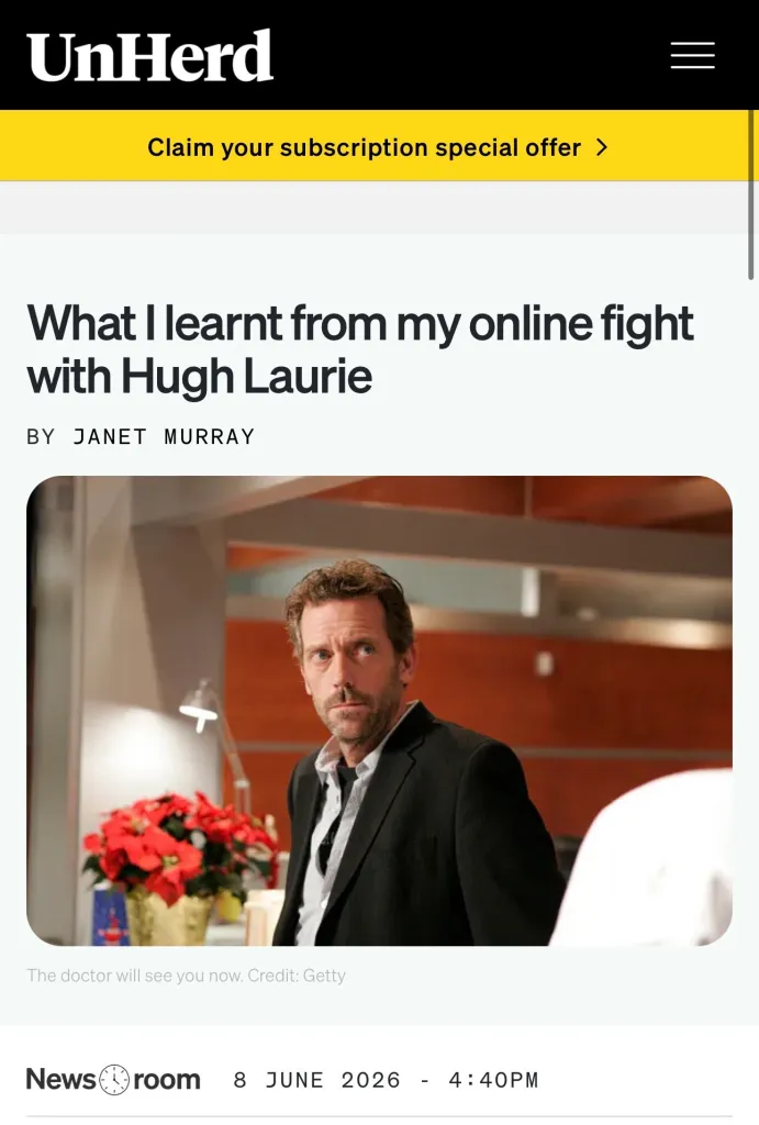 Hugh Laurie as Dr. House in a black suit.