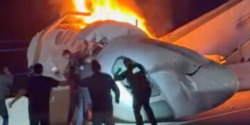 Drivers rush to help after private jet crashes on highway, killing 1 person
