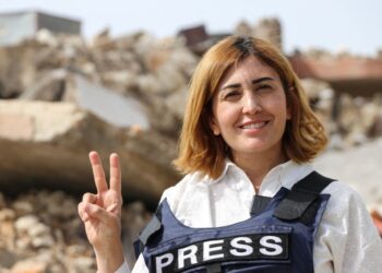 An airstrike trapped a journalist. She died as rescuers waited for permission to save her.