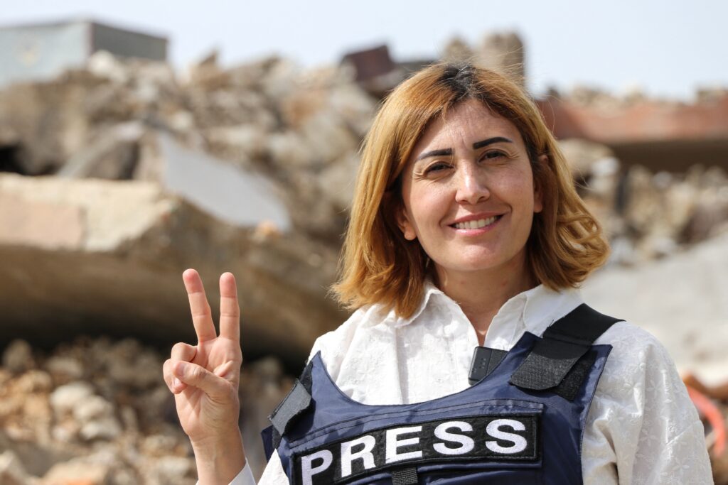 An airstrike trapped a journalist. She died as rescuers waited for permission to save her.