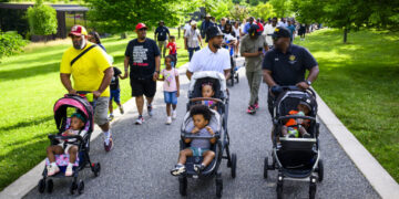 These stroller-pushing fathers came together for a walk. They left with more.