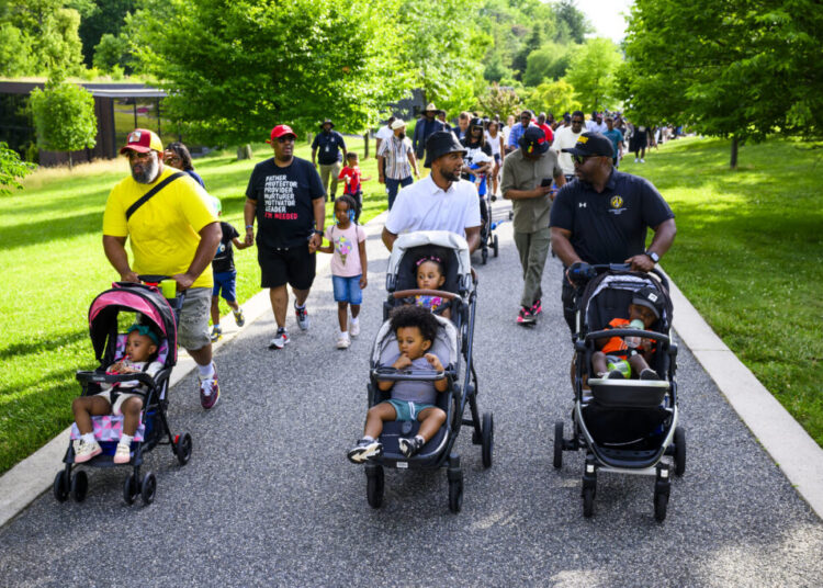 These stroller-pushing fathers came together for a walk. They left with more.