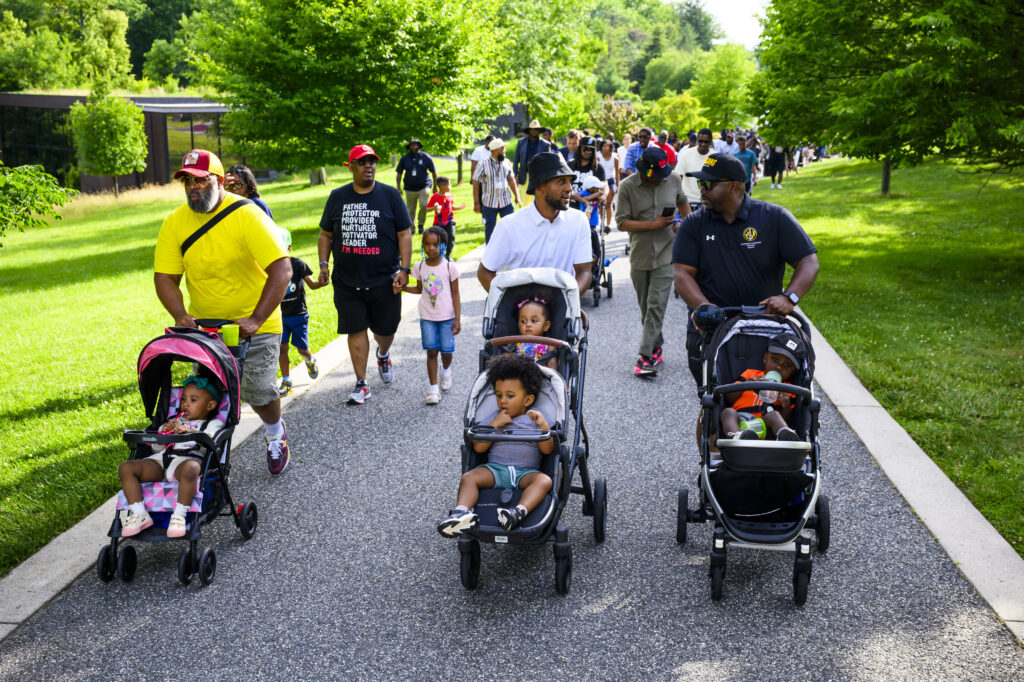 These stroller-pushing fathers came together for a walk. They left with more.