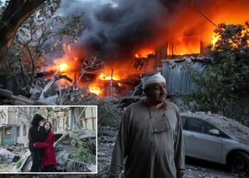 Russian attack on Ukraine kills at least 11 and traps others in damaged buildings