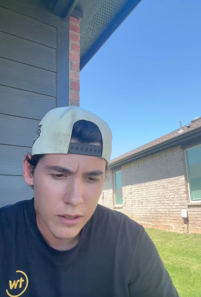 Tyler wearing a backwards cap.
