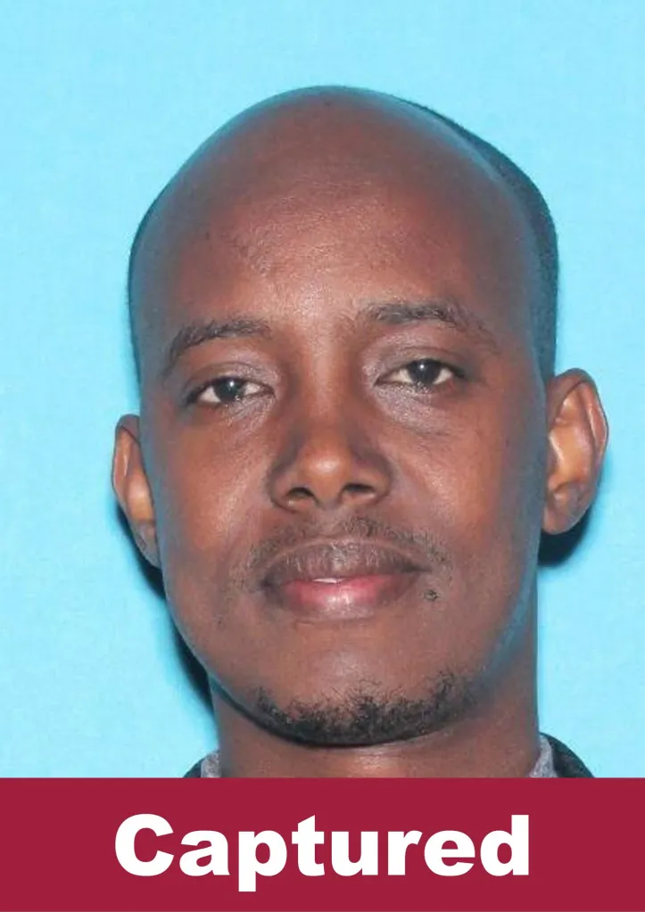Mugshot of Abdikerm Eidleh, an alleged suspect in a $250M Minnesota fraud case, with 