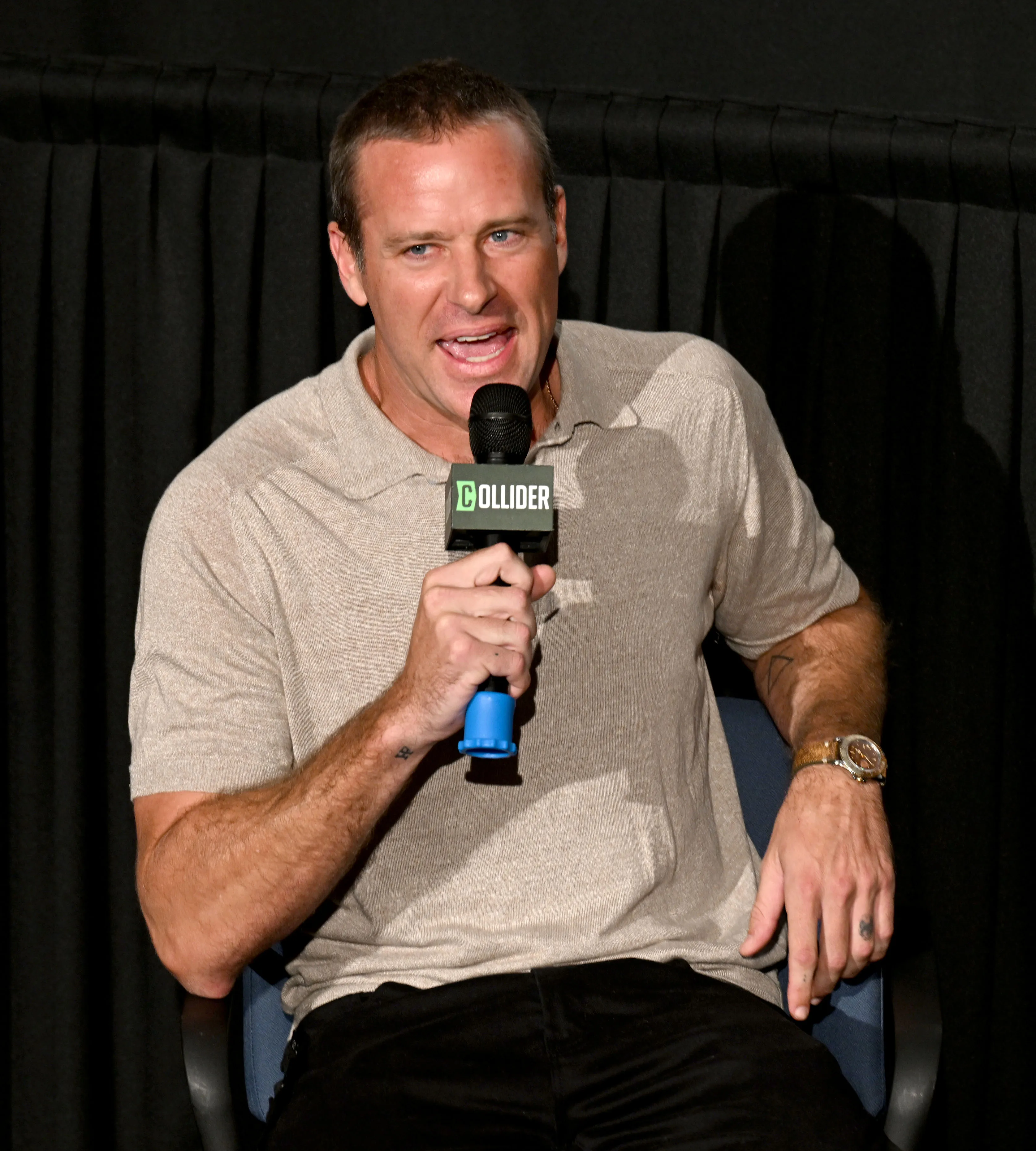 Armie Hammer speaking into a Collider microphone.