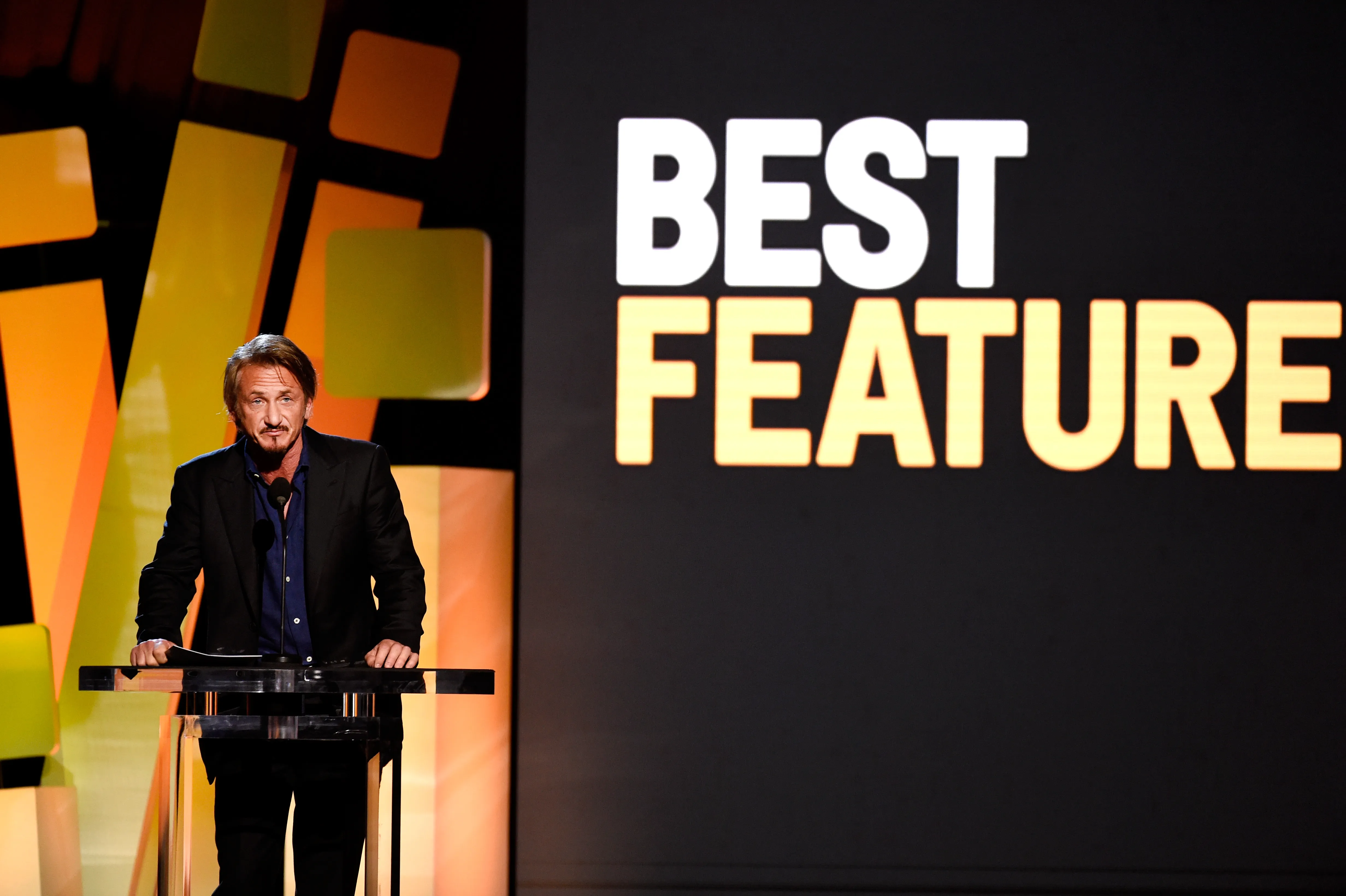 Actor Sean Penn speaks onstage at an awards ceremony.