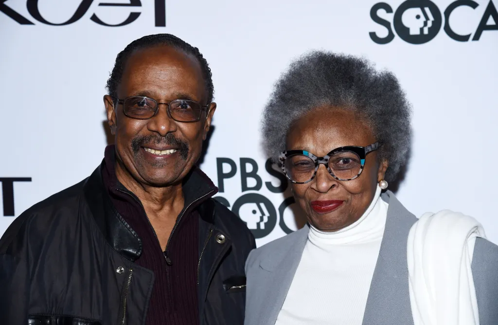 Composer Harold Wheeler and actress Hattie Winston Wheeler posing at a premiere.