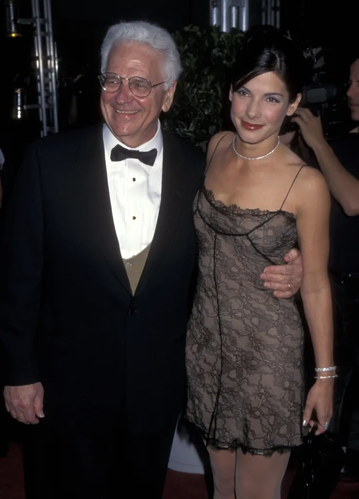 Actress Sandra Bullock and her father, John Bullock, smiling.