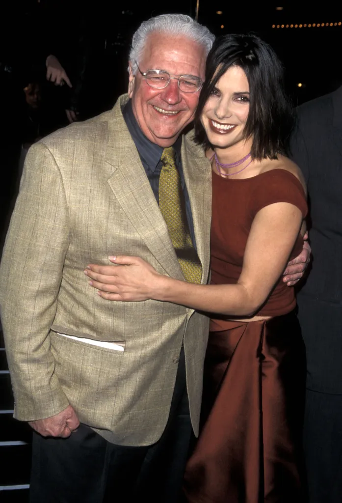 Sandra Bullock and her father John Bullock pose smiling at the 