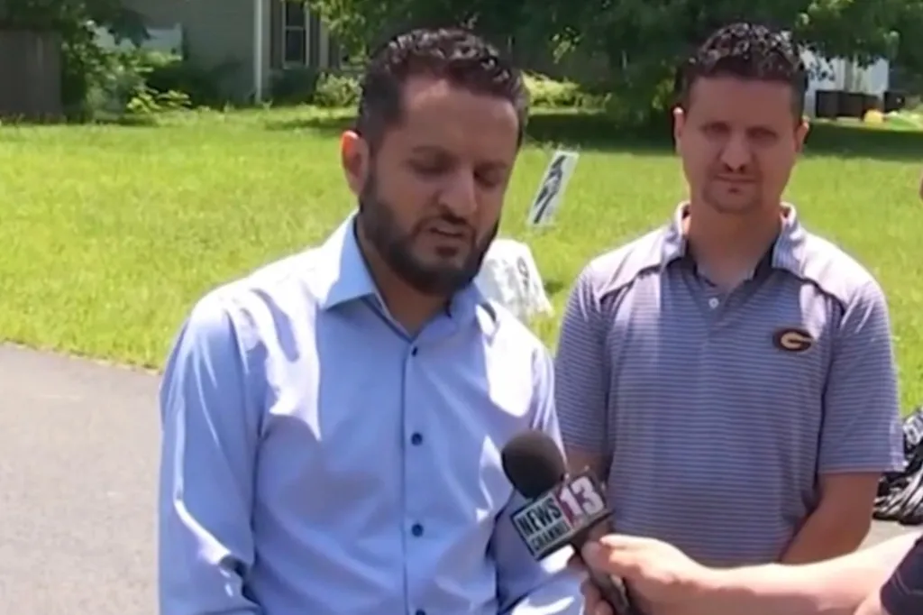 Alharbi being interviewed by News 13, with another man standing behind him, asking the public to keep his family in their thoughts during the search for his missing nephew.