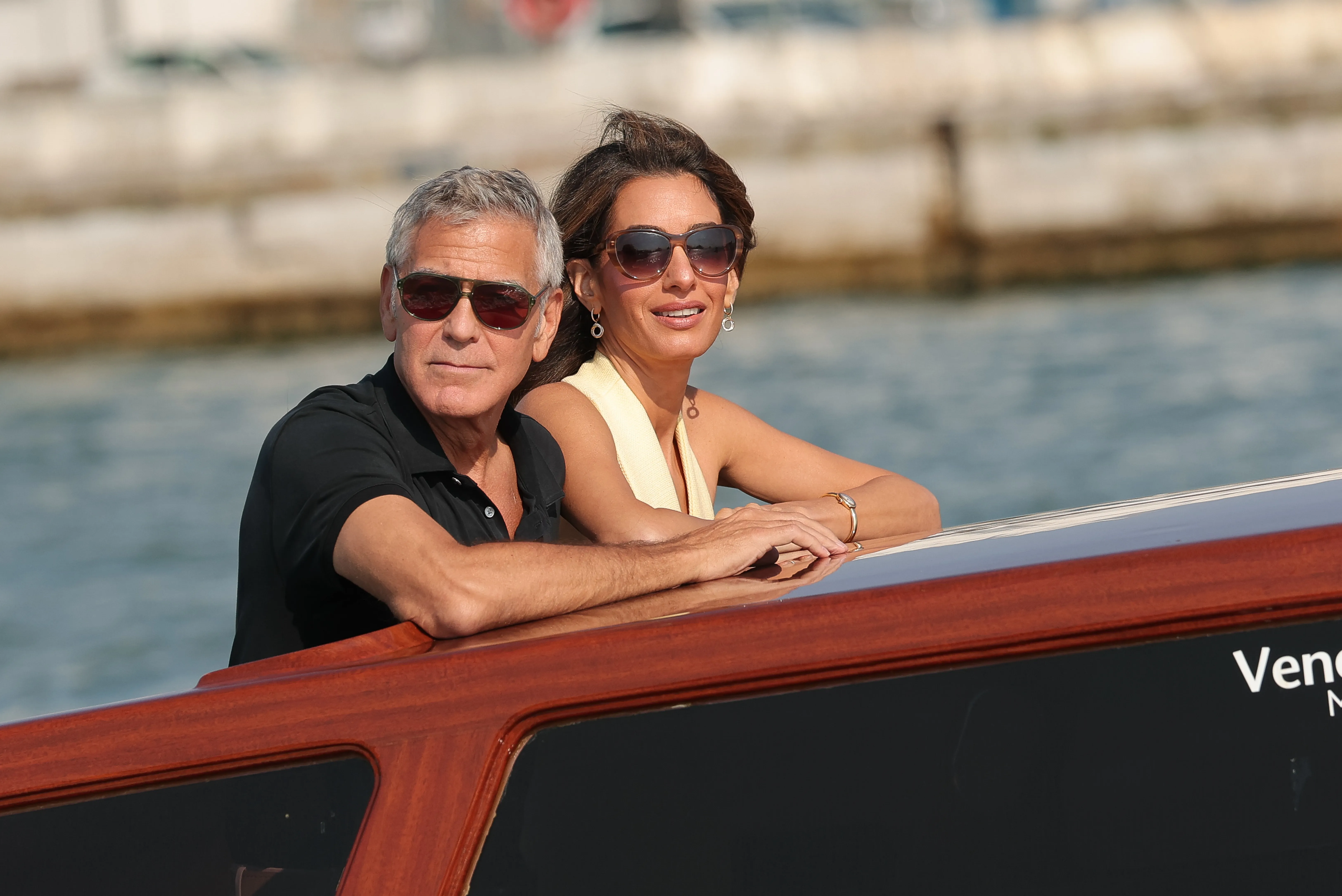 George and Amal Clooney on a boat in Venice.