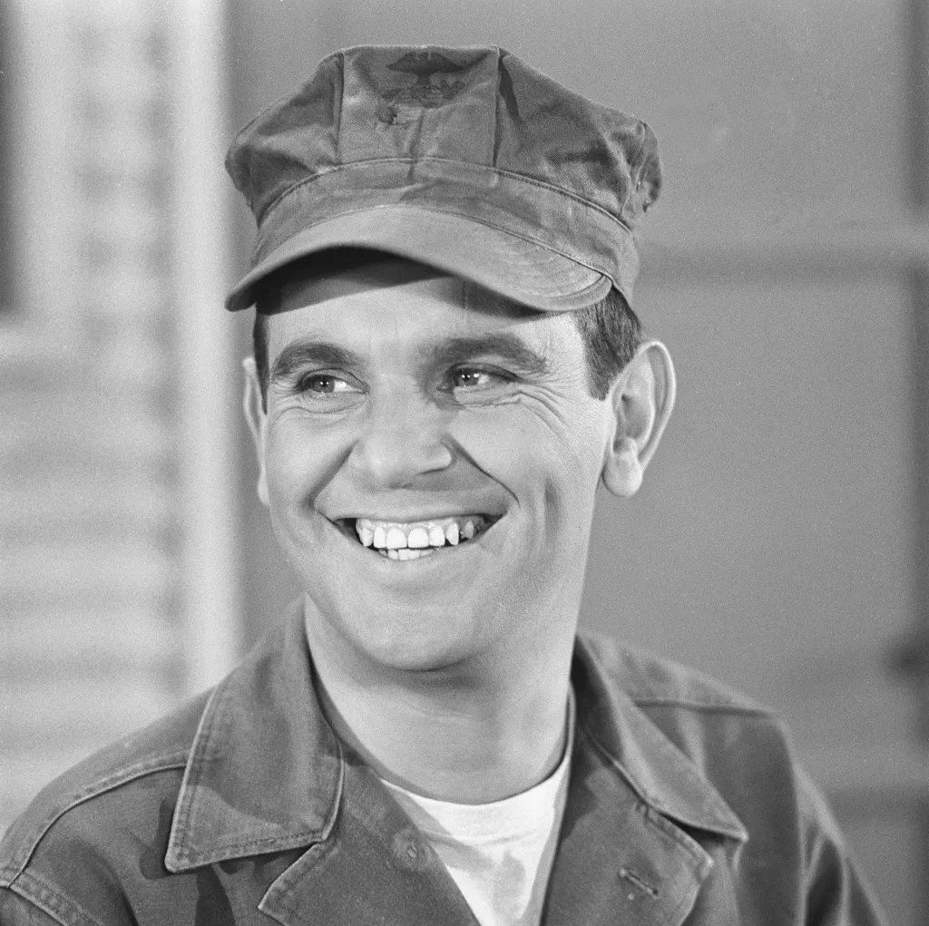 Ronnie Schell smiling in a scene from 